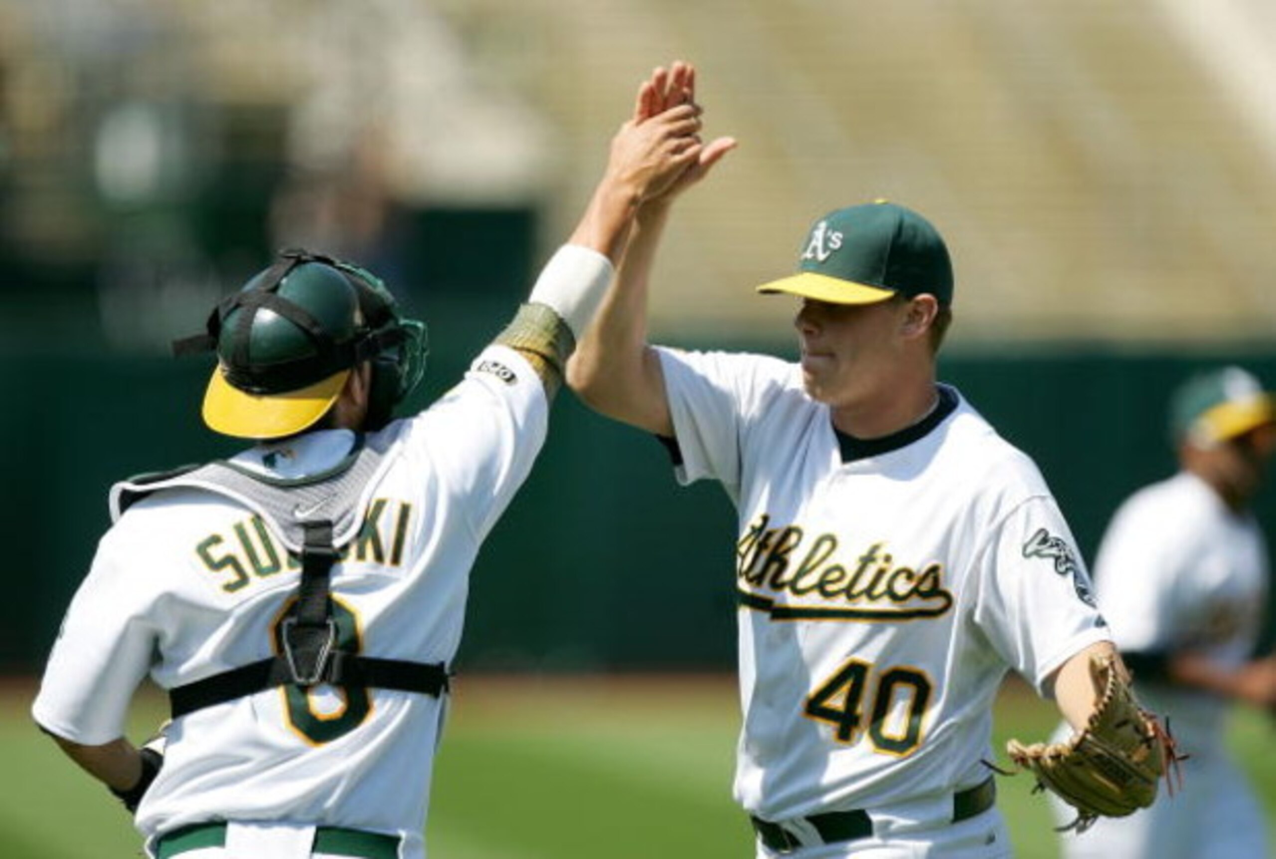 OAKLAND, CA - JUNE 07:  Kurt Suzuki #8 of the Oakland Athletics congratulates relief pitcher Andrew Bailey #40 after the Athletics beat the Baltimore Orioles at the Oakland Coliseum on June 7, 2009 in Oakland, California.  (Photo by Ezra Shaw/Getty Images