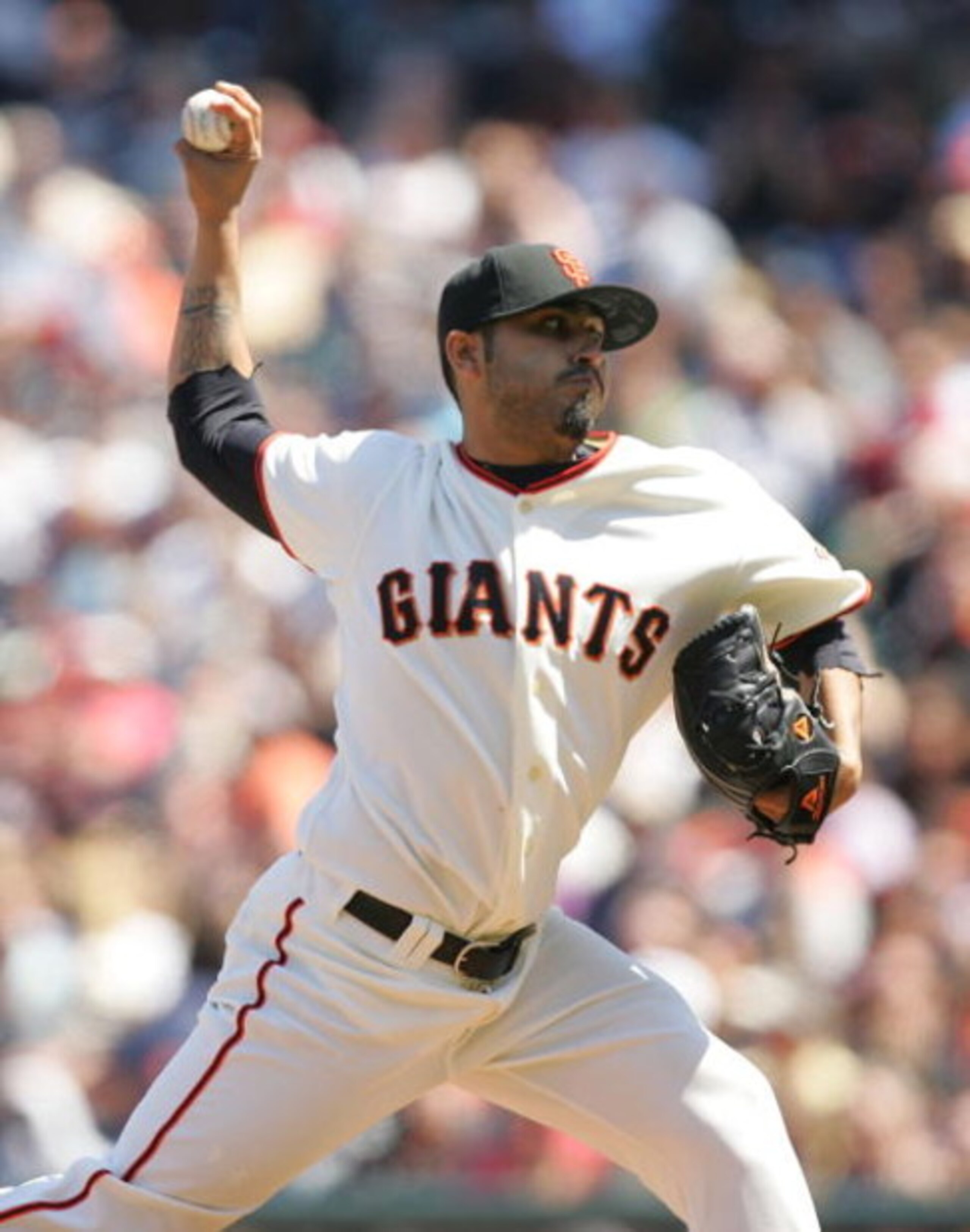 SAN FRANCISCO - JUNE 17:  Sergio Romo #54 of the San Francisco Giants pitches against the Los Angeles Angels of Anaheim at AT&T Park on June 17, 2009 in San Francisco, California.  (Photo by Ezra Shaw/Getty Images)
