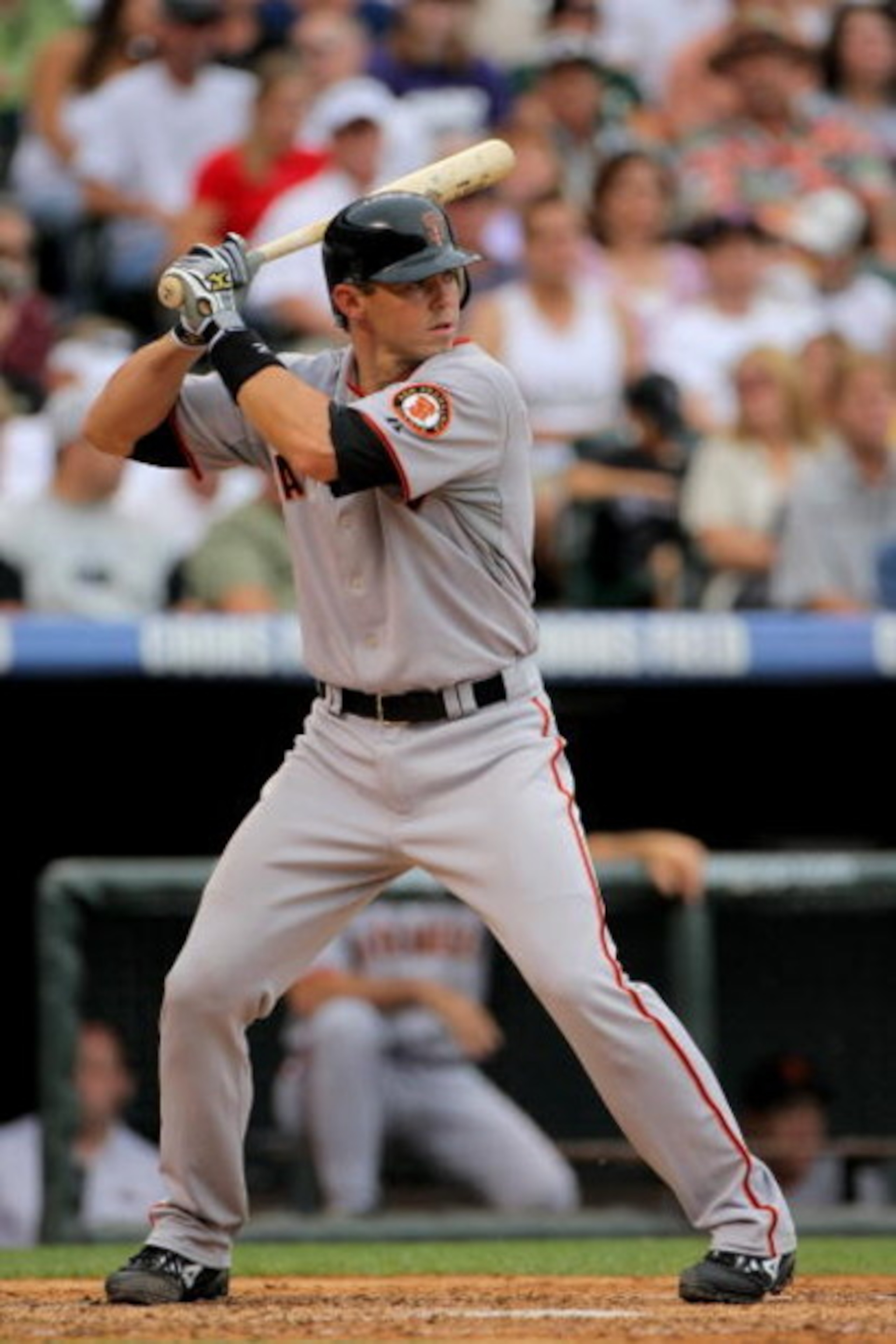 DENVER - JULY 26:  Catcher Eli Whiteside #22 of the San Francisco Giants takes an at bat against the Colorado Rockies at Coors Field on July 26, 2009 in Denver, Colorado. The Rockies defeated the Giants 4-2.  (Photo by Doug Pensinger/Getty Images)