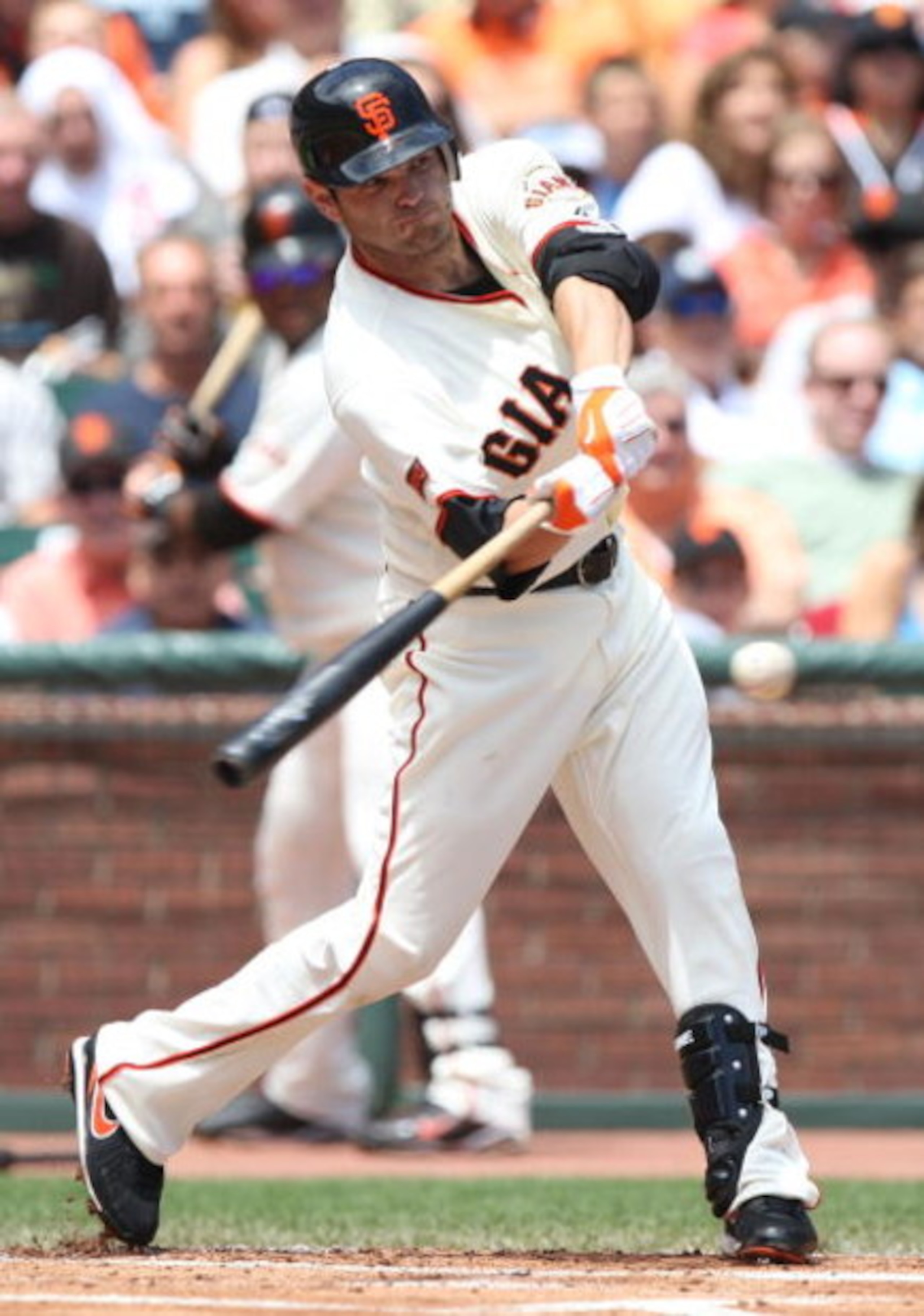 SAN FRANCISCO - AUGUST 02:  Freddy Sanchez #21 of the San Francisco Giants singles in the first inning against the Philadelphia Phillies during a Major League Baseball game at AT&T Park on August 2, 2009 in San Francisco, California.  (Photo by Jed Jacobs