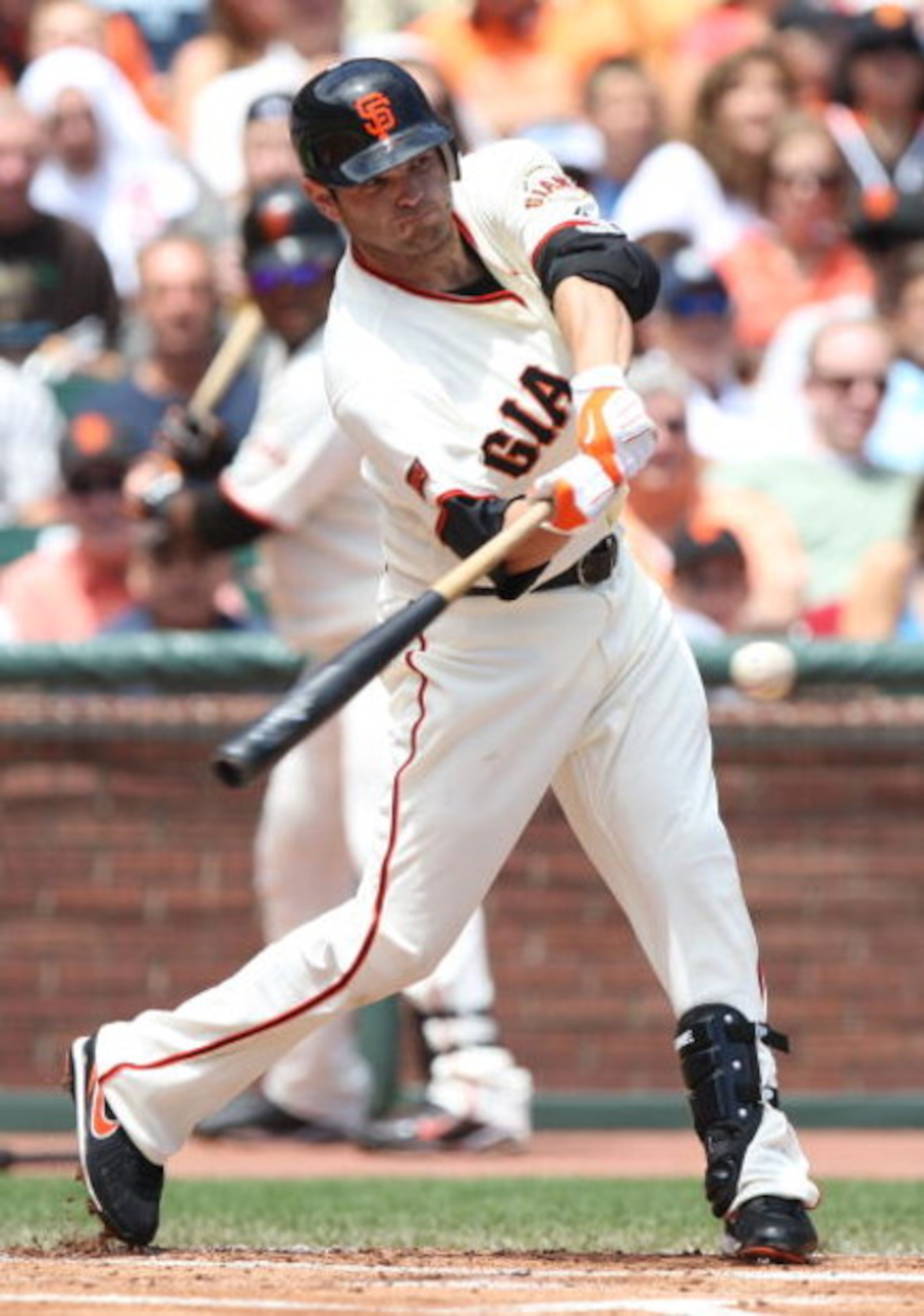 SAN FRANCISCO - AUGUST 02:  Freddy Sanchez #21 of the San Francisco Giants singles in the first inning against the Philadelphia Phillies during a Major League Baseball game at AT&T Park on August 2, 2009 in San Francisco, California.  (Photo by Jed Jacobs