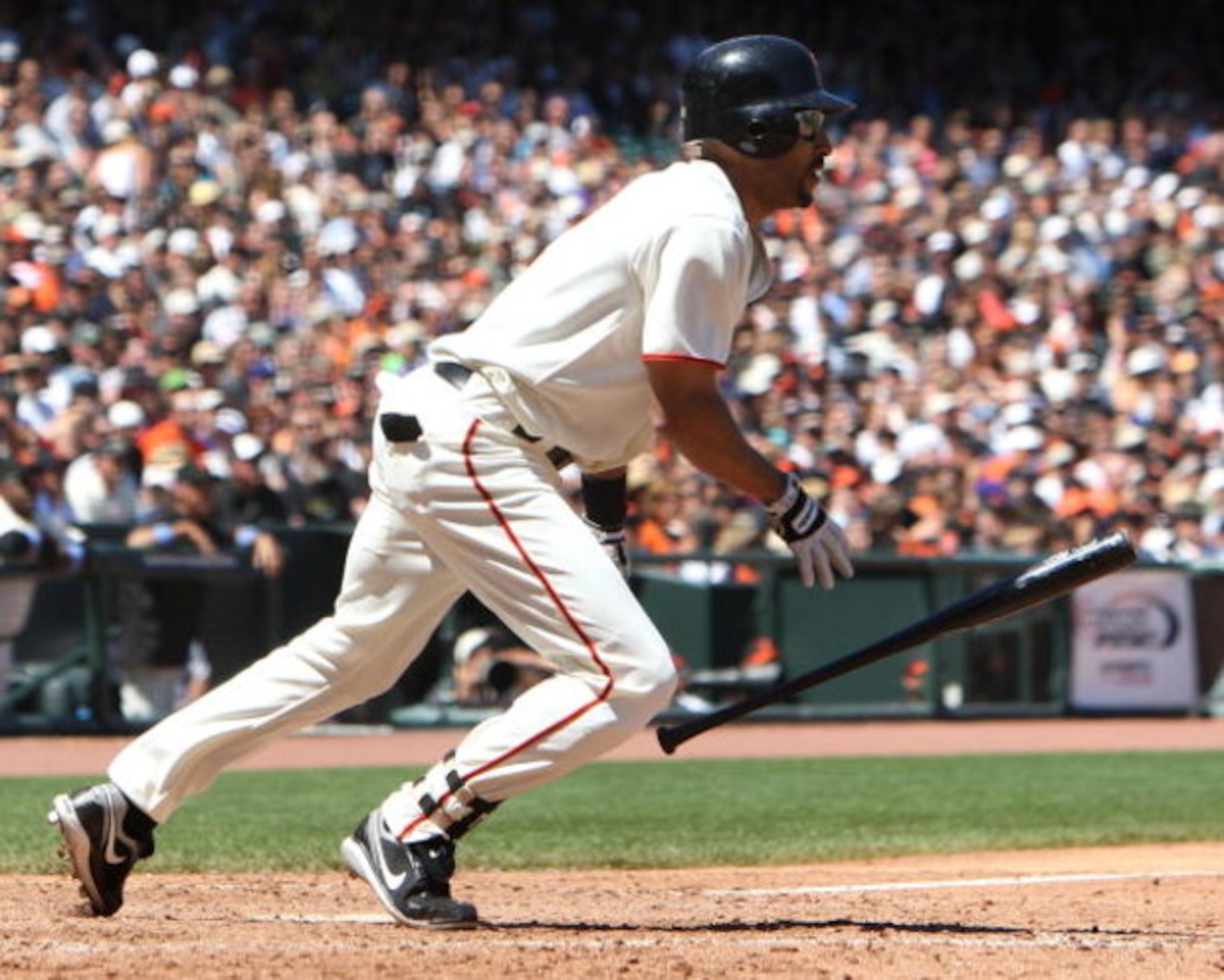 SAN FRANCISCO - JUNE 21: Randy Winn #2 of the San Francisco Giants hits an RBI single in the 7th inning against the Texas Rangers during a Major League Baseball game on June 21, 2009 at AT&T Park in San Francisco, California. (Photo by Jed Jacobsohn/Getty