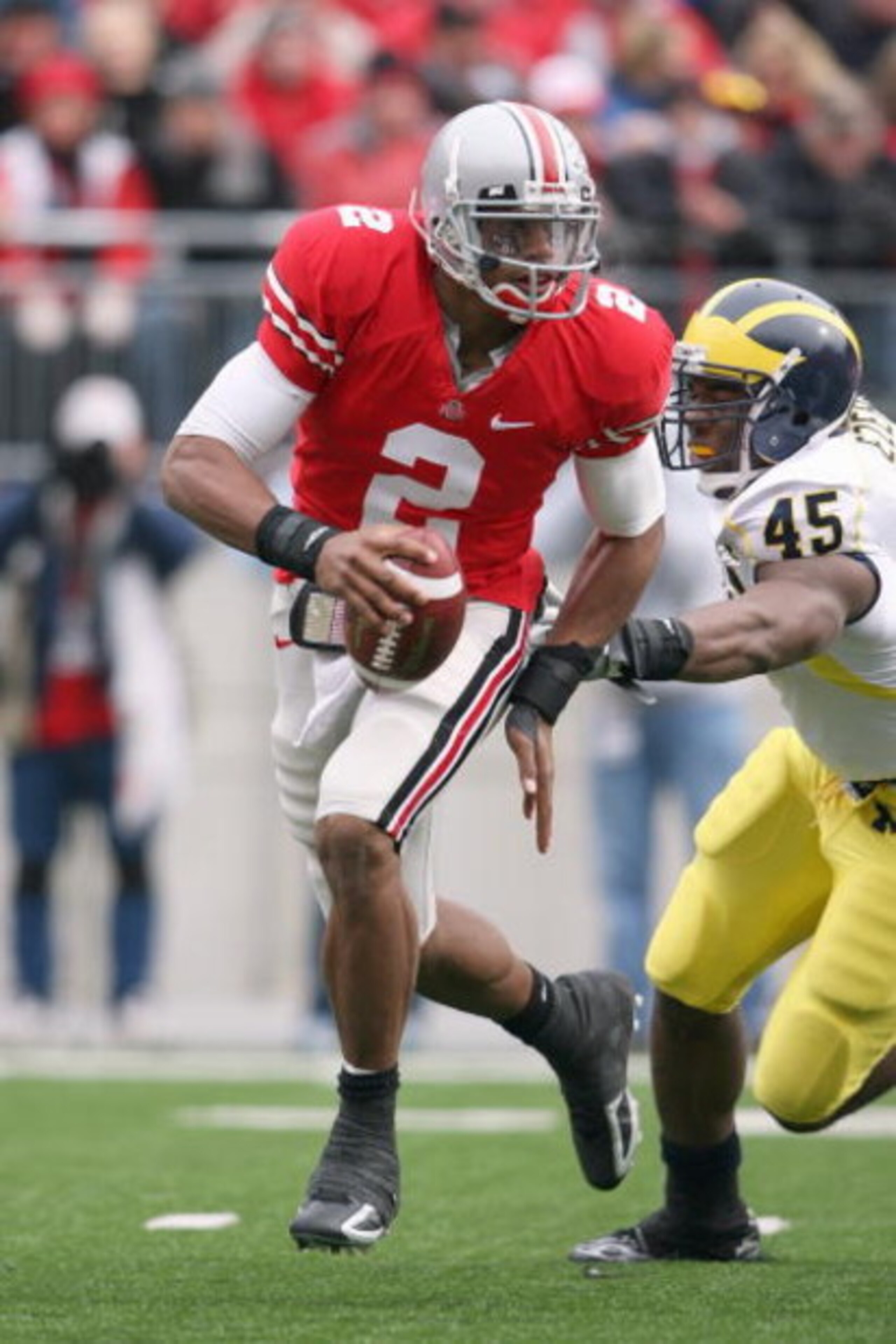 COLUMBUS, OH - NOVEMBER 22:  Quarterback Terrelle Pryor #2 of the Ohio State Buckeyes moves to pass the ball against Obinna Ezeh #45 of the Michigan Wolverines during the Big Ten Conference game at Ohio Stadium on November 22, 2008 in Columbus, Ohio.  (Ph