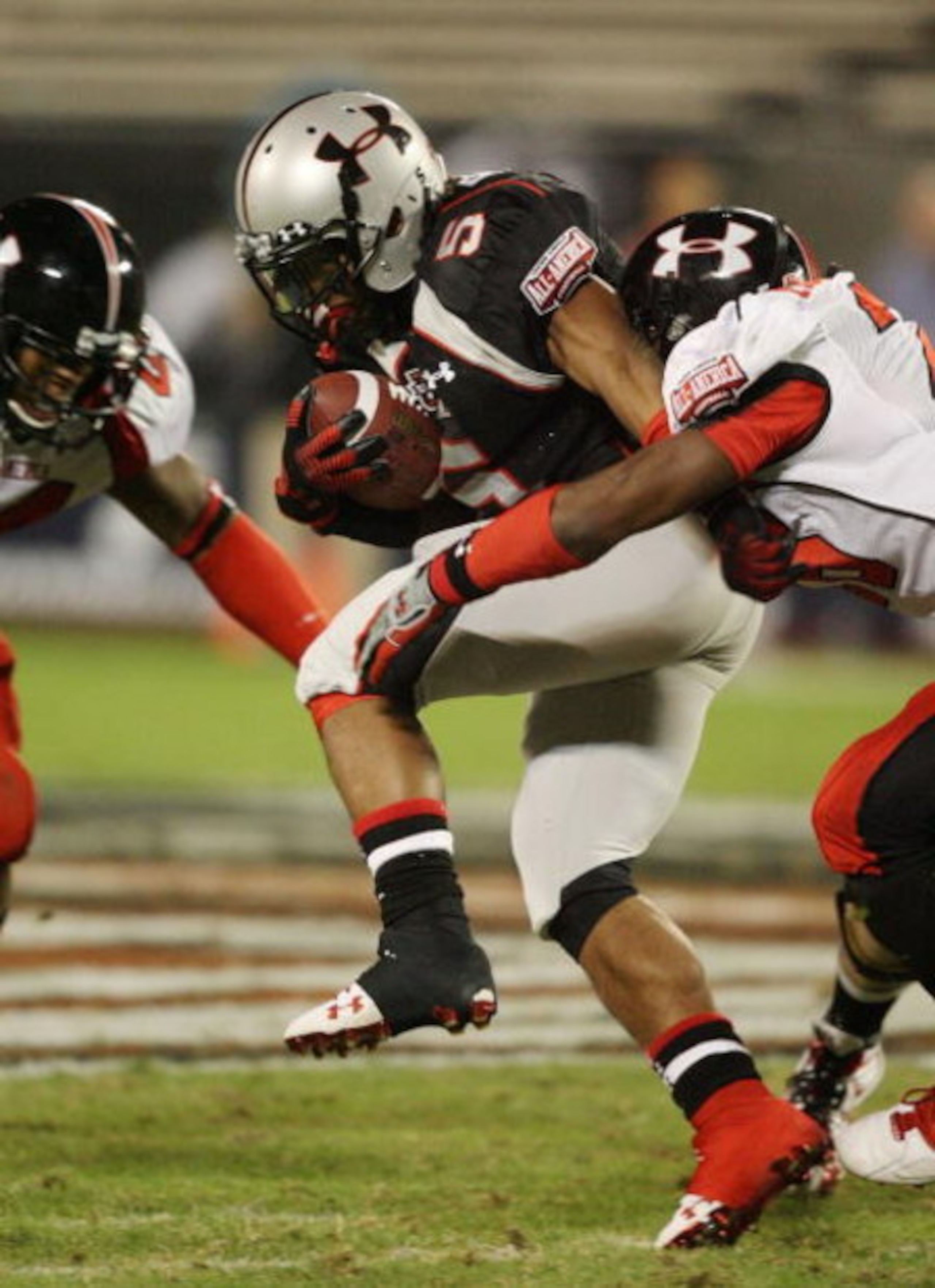 ORLANDO, FL - JANUARY 04:  Running back Jaamal Berry #5 of the black team is brought down before fumbling in the All America Under Armour Football Game at Florida Citrus Bowl on January 4, 2009 in Orlando, Florida.  (Photo by Doug Benc/Getty Images)