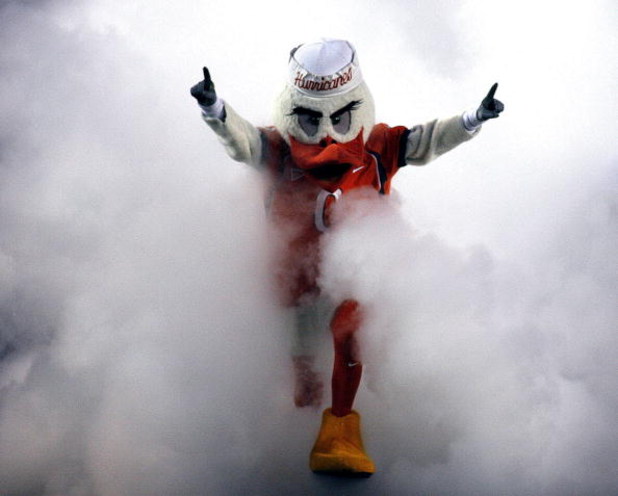 MIAMI - OCTOBER 14:  'Ibis' the University of Miami Hurricanes mascot runs through a smoke cloud prior to a game against the Florida International University Panthers at the Orange Bowl on October 14, 2006 in Miami, Florida.  (Photo by Marc Serota/Getty I