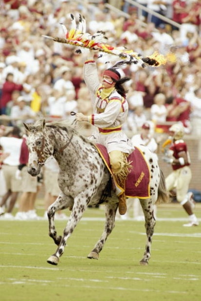 TALLAHASSEE, FL - OCTOBER 26:   Florida State Seminoles' mascot, Chief Osceola, rides his Appaloosa, Renegade, before planting the flaming spear before the NCAA football game against Notre Dame at Doak Campbell Stadium on October 26, 2002 in Tallahassee, 