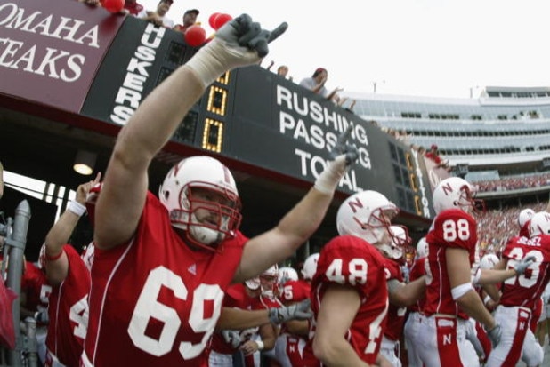 LINCOLN, NE - AUGUST 24:  Tackle Nick Povendo #69 of the Nebraska Cornhuskers explodes out of the tunnel before the NCAA football game against the Arizona State Sun Devils on August 24, 2002, at Memorial Stadium in Lincoln, Nebraska.  Nebraska defeated Ar
