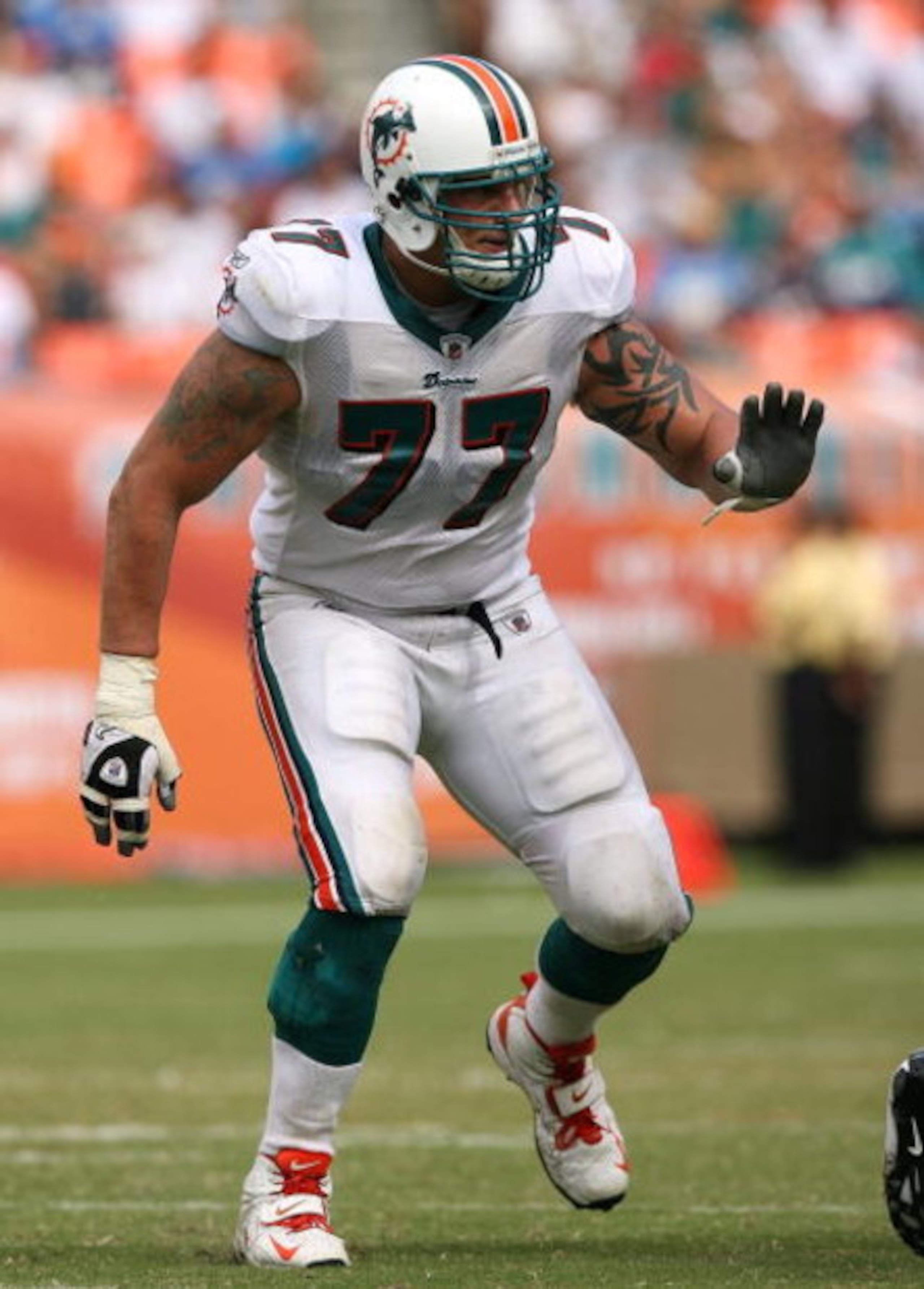 MIAMI - OCTOBER 05:  Offensive lineman Jake Long #77 of the Miami Dolphins blocks while taking on the San Diego Chargers at Dolphin Stadium on October 5, 2008 in Miami, Florida. The Dolphins defeated the Chargers 17-10.  (Photo by Doug Benc/Getty Images)