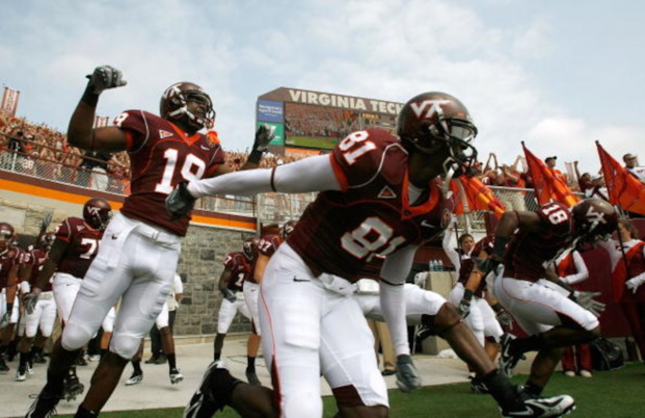 BLACKSBURG, VA - SEPTEMBER 01:  The Virginia Tech football team takes the field after a ceremony honoring the 32 victims of the shooting at the school, before the start of the season opener September 1, 2007 at Lane Stadium in Blacksburg, Virginia. In add