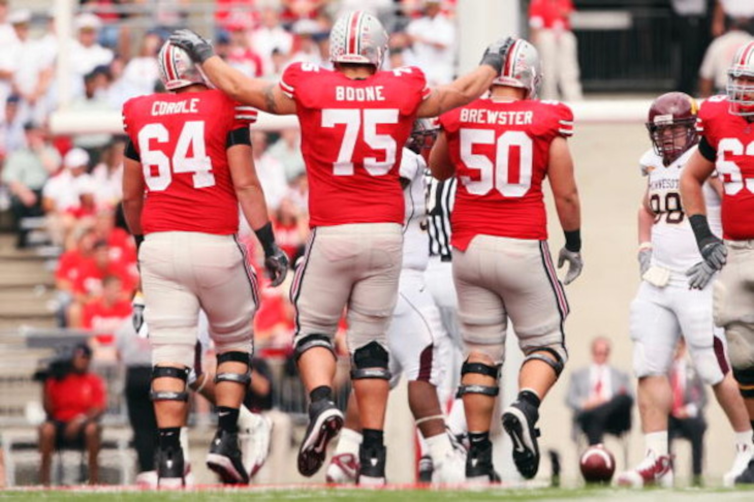 COLUMBUS, OH - SEPTEMBER 27:  Offensive lineman Jim Cordle #64, Alex Boone #75 and Mike Brewster #50 of the Ohio State Buckeyes walk up the line of scrimmage in the second half of a 34-21 victory over the Minnesota Golden Gophers on September 27, 2008 at 