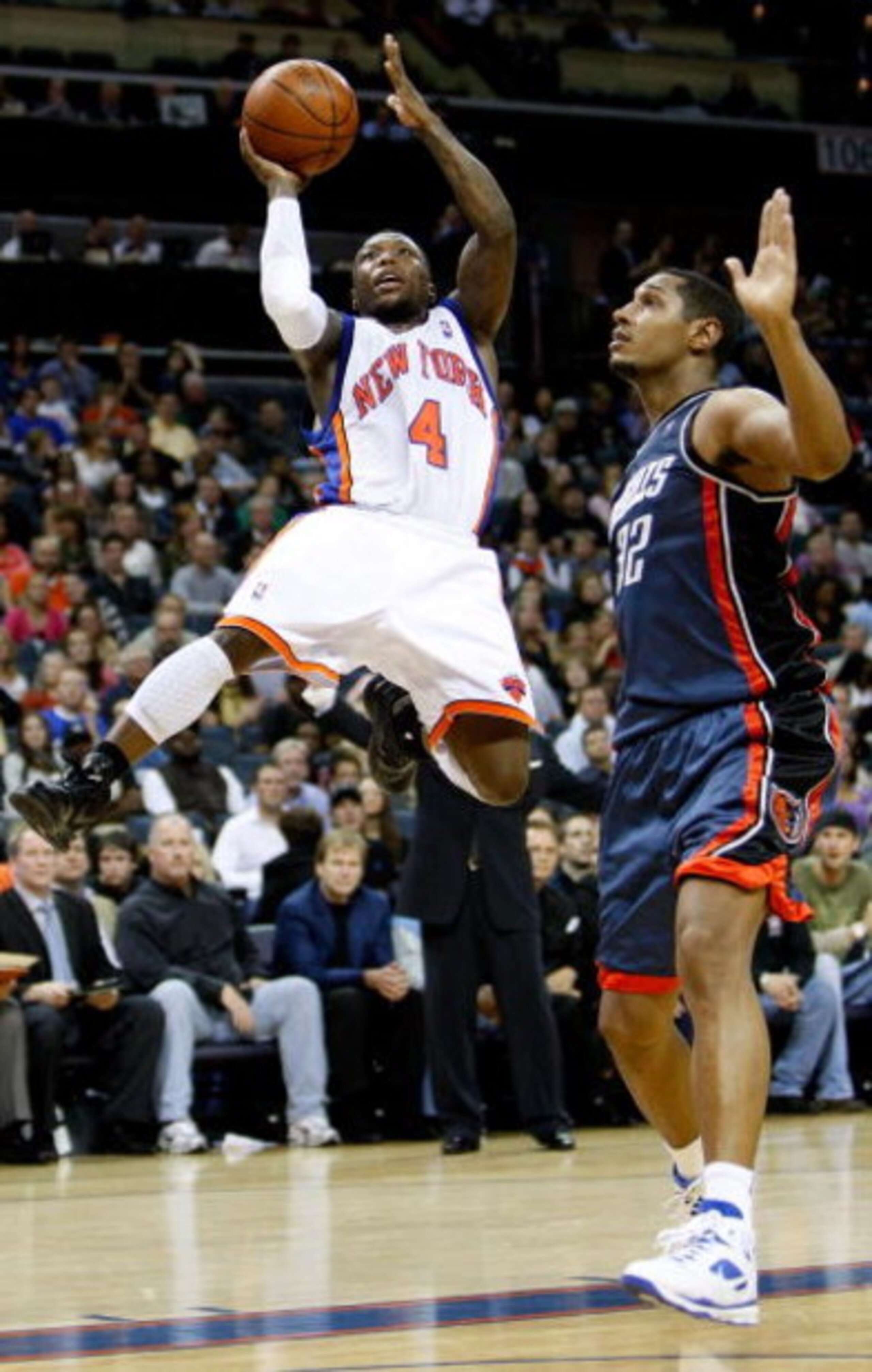CHARLOTTE, NC - MARCH 28:  Boris Diaw #32 of the Charlotte Bobcats watches as Nate Robinson #4 of the New York Knicks goes to the basket during their game at Time Warner Cable Arena on March 28, 2009 in Charlotte, North Carolina.  NOTE TO USER: User expre