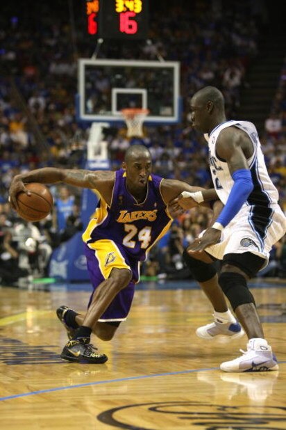 ORLANDO, FL - JUNE 14:  Kobe Bryant #24 of the Los Angeles Lakers moves the ball against Mickael Pietrus #20 of the Orlando Magic in Game Five of the 2009 NBA Finals on June 14, 2009 at Amway Arena in Orlando, Florida. The Lakers won 99-86. NOTE TO USER: 