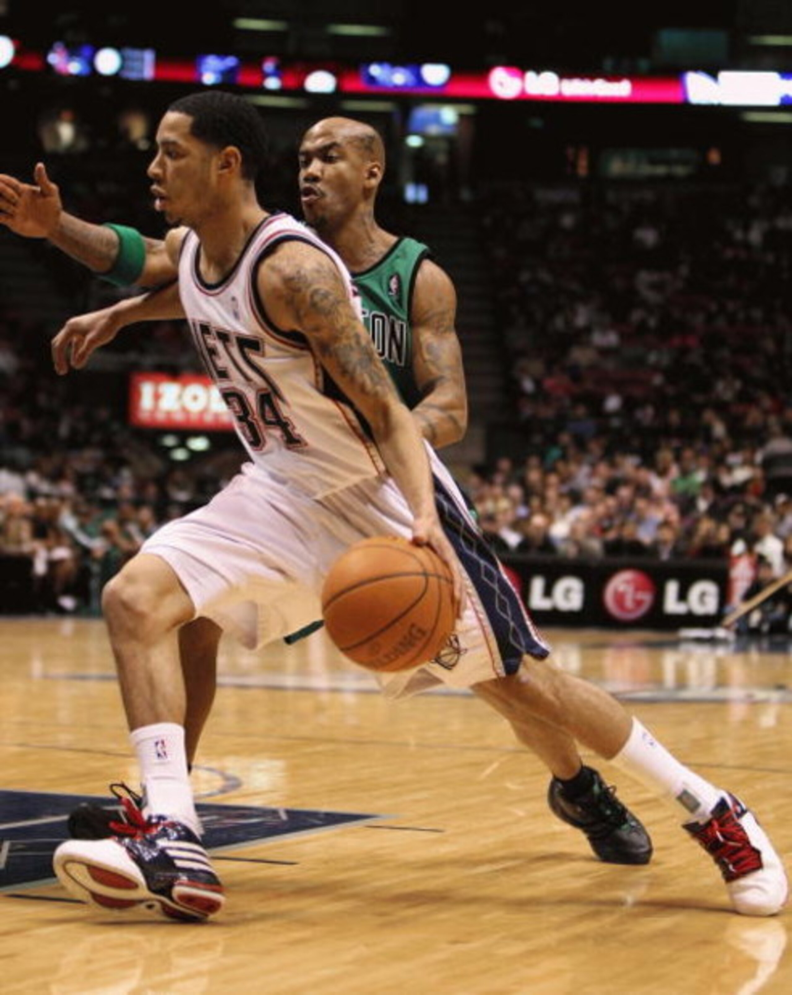 EAST RUTHERFORD, NJ - MARCH 04:  Devin Harris #34 of the New Jersey Nets dribbles the ball against Stephon Marbury #8 of Boston Celtics during their game on March 4th, 2009 at The Izod Center in East Rutherford, New Jersey.  NOTE TO USER: User expressly a