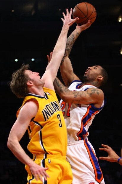 NEW YORK - FEBRUARY 23:  Wilson Chandler #21 of the New York Knicks goes up for a shot against Troy Murphy #3 of the Indiana Pacers at Madison Square Garden February 23, 2009 in New York City. NOTE TO USER: User expressly acknowledges and agrees that, by 