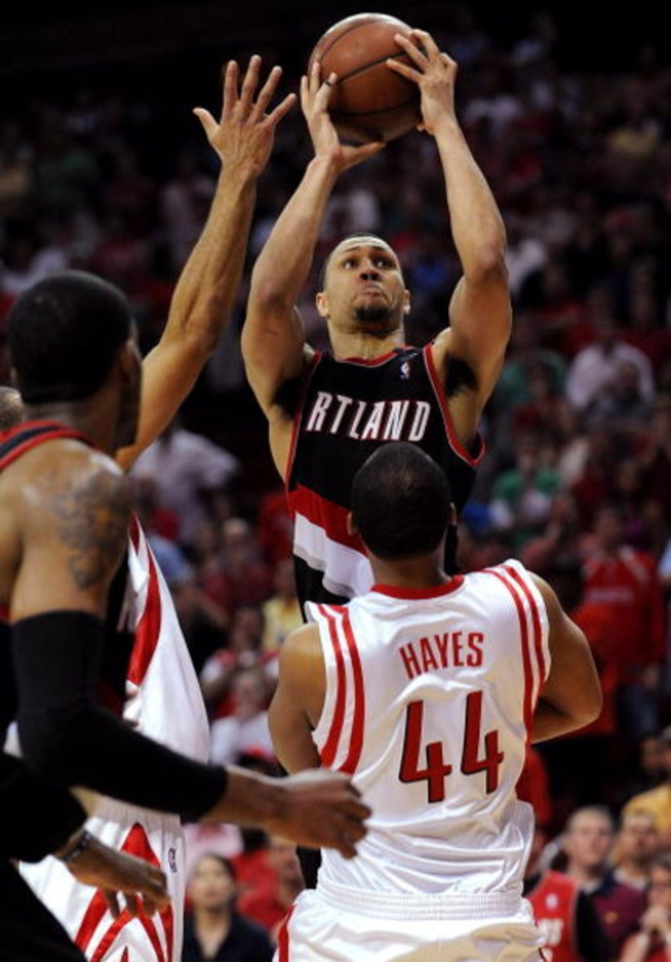 HOUSTON - APRIL 26:  Guard Brandon Roy #7 of the Portland Trail Blazers goes up for a shot where he is called for an offensive foul against Chuck Hayes #44 of the Houston Rockets in the last minute of play in Game Four of the Western Conference Quarterfin