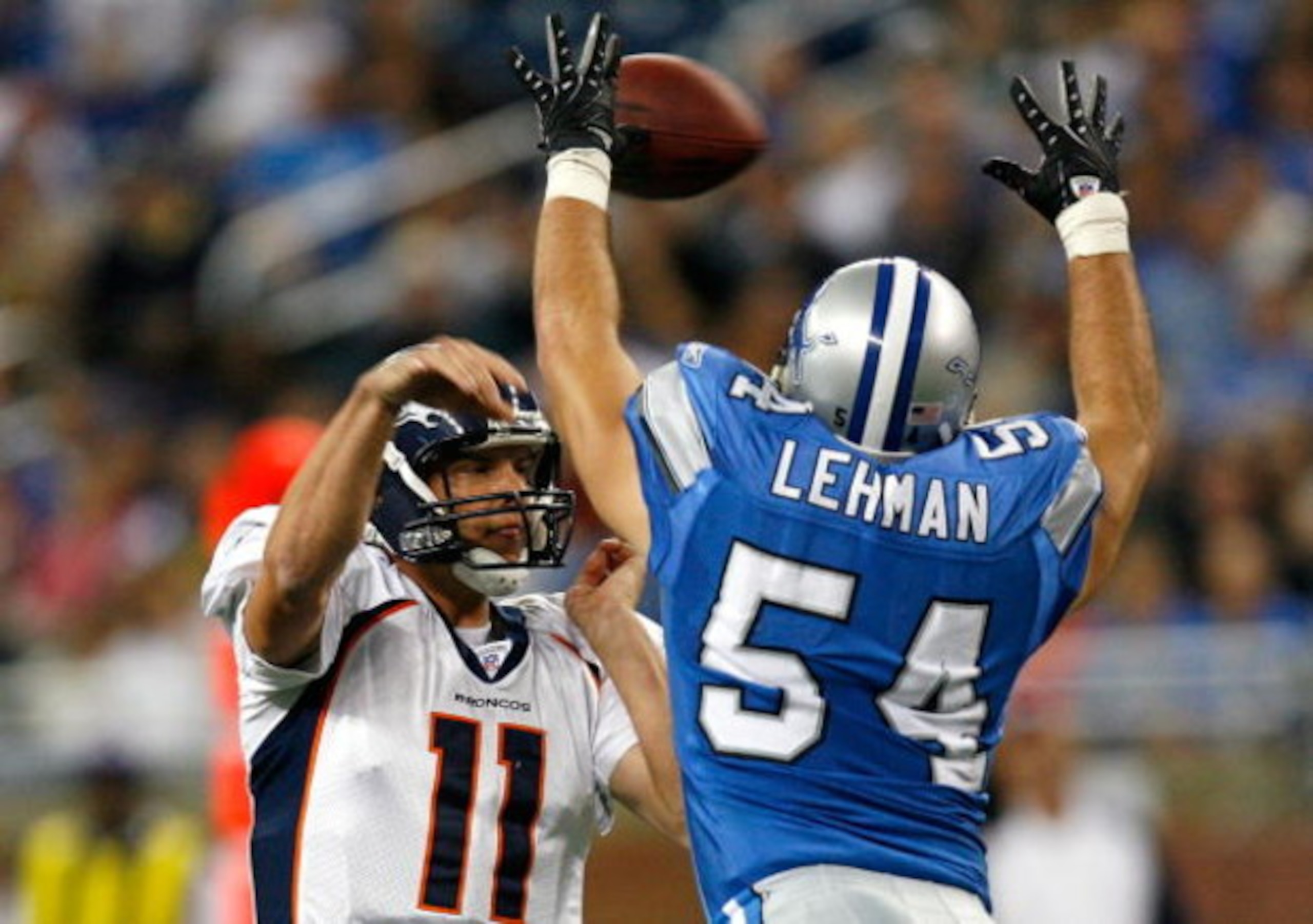 DETROIT - NOVEMBER 04:  Quarterback Patrick Ramsey #11 of the Denver Broncos is pressured by linebacker Teddy Lehman #54 of the Detroit Lions during the second half at Ford Field November 4, 2007 in Detroit, Michigan.  Detroit defeated Denver 44-7.  (Phot