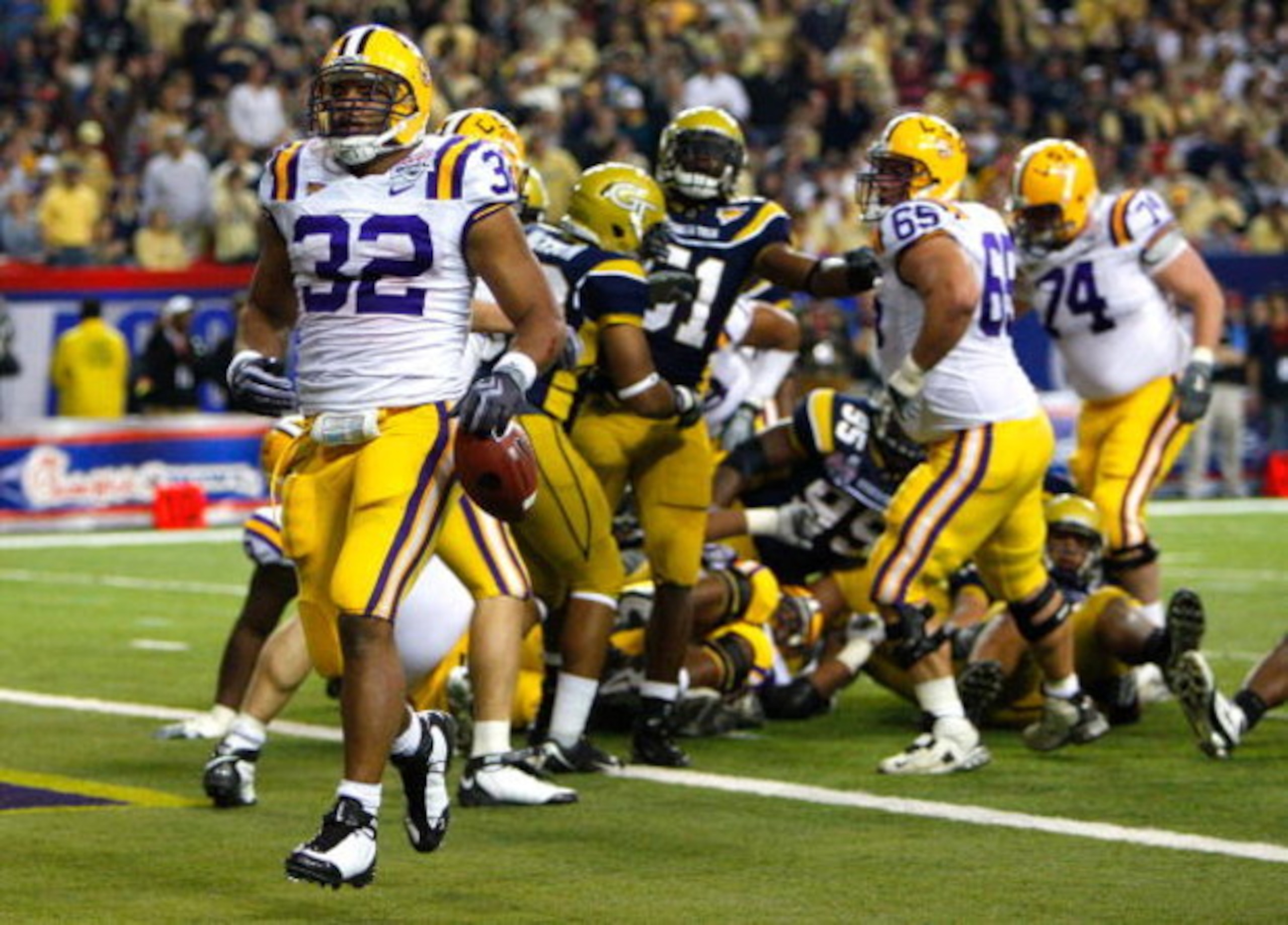 ATLANTA - DECEMBER 31:  Running back Charles Scott #32 of the LSU Tigers scores a touchdown against the Georgia Tech Yellow Jackets during the Chick-fil-A Bowl on December 31, 2008 at the Georgia Dome in Atlanta, Georgia.  (Photo by Kevin C. Cox/Getty Ima