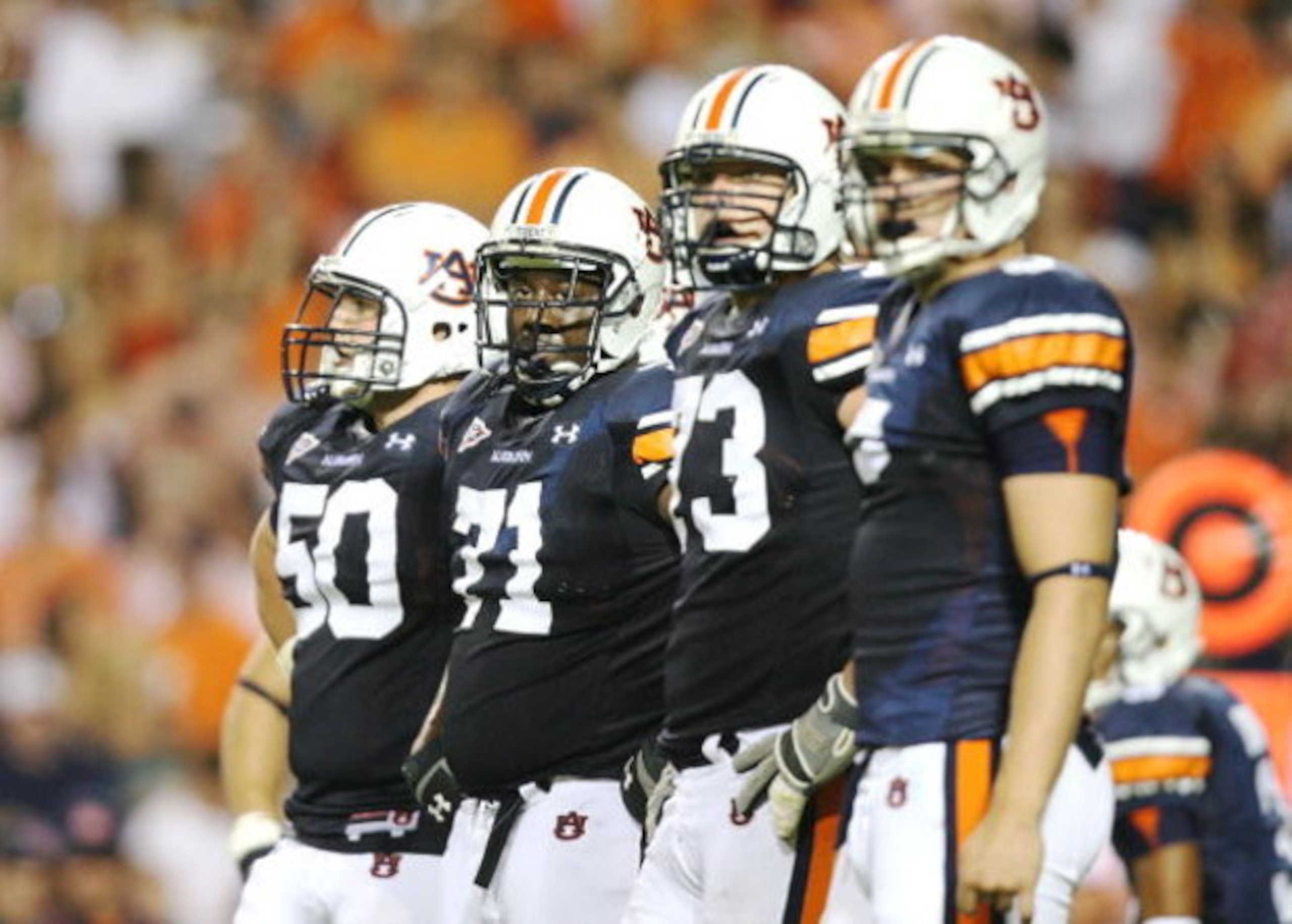 AUBURN, AL - SEPTEMBER 20:  Offensive lineman Ryan Pugh #50, Tyronne Green #71, Lee Ziemba #73 and tight end Tommy Trott #5 of the Auburn Tigers prepare for a play while taking on the LSU Tigers at Jordan-Hare Stadium on September 20, 2008 in Auburn, Alab