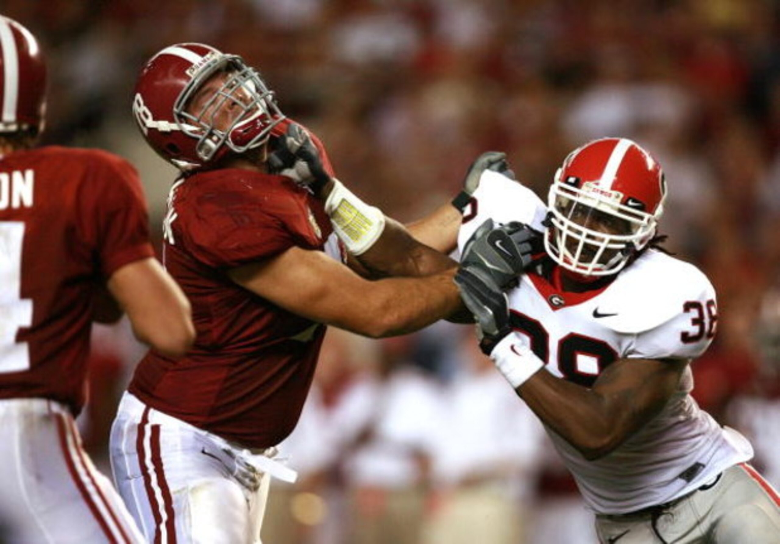 TUSCALOOSA, AL - SEPTEMBER 22:  Defensive end Marcus Howard #38 of the Georgia Bulldogs battles with lineman Mike Johnson #78 of the Alabama Crimson Tide at Bryant-Denny Stadium September 22, 2007 in Tuscaloosa, Alabama. Georgia defeated Alabama 26-23 in 