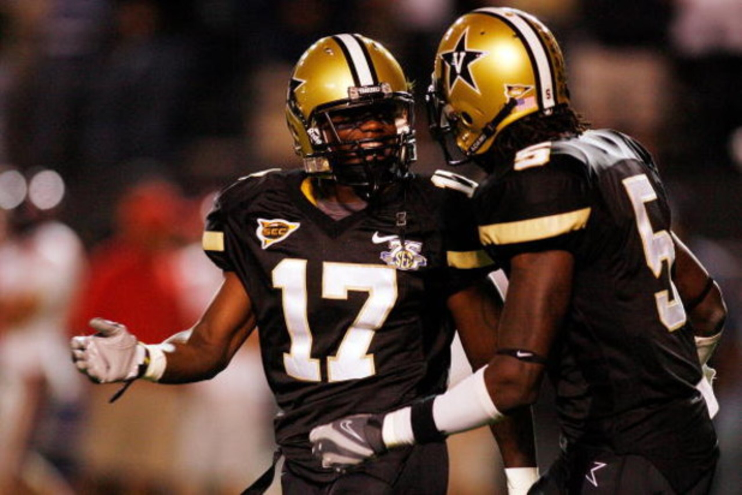 NASHVILLE, TN - SEPTEMBER 15:  D.J. Moore #17 and Myron Lewis #5 of the Vanderbilt Commodores react to a play against the Ole Miss Rebels on September 15, 2007 at Vanderbilt Stadium in Nashville, Tennessee.  The Commodores defeated the Rebels 31-17.  (Pho