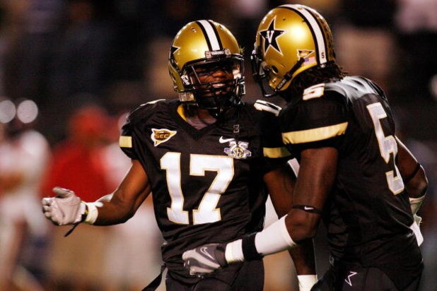 NASHVILLE, TN - SEPTEMBER 15:  D.J. Moore #17 and Myron Lewis #5 of the Vanderbilt Commodores react to a play against the Ole Miss Rebels on September 15, 2007 at Vanderbilt Stadium in Nashville, Tennessee.  The Commodores defeated the Rebels 31-17.  (Pho