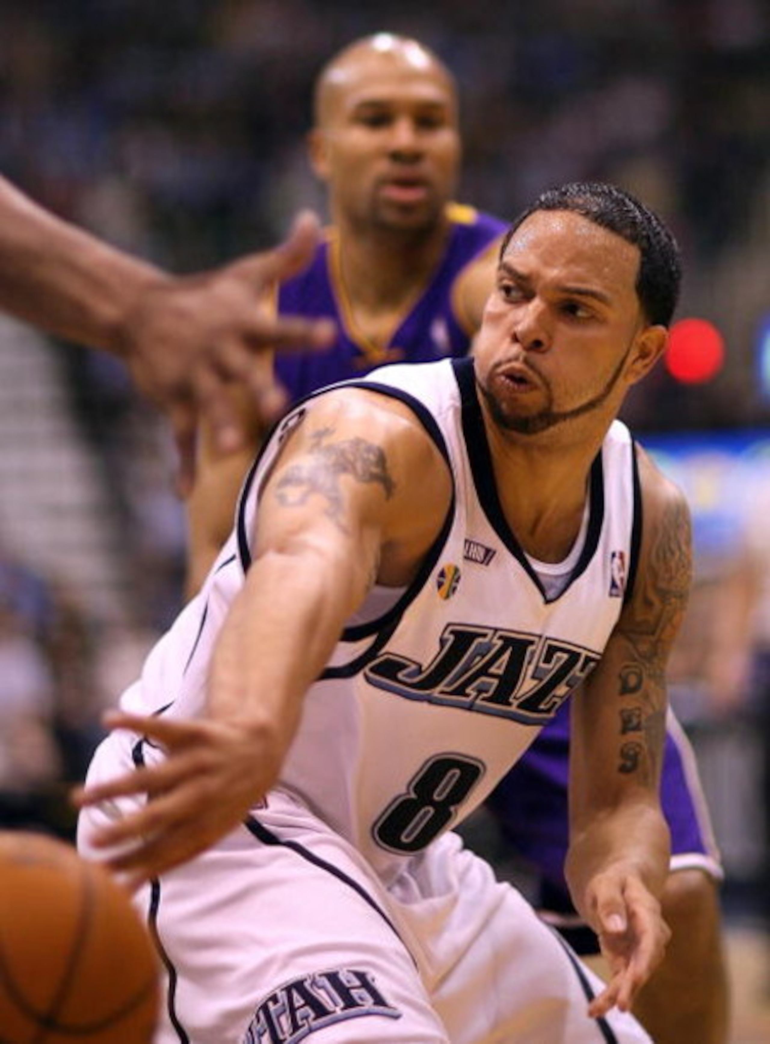 SALT LAKE CITY - APRIL 25:  Deron Williams #8 of the Utah Jazz passes against the Los Angeles Lakers in Game Four of the Western Conference Quarterfinals during the 2009 NBA Playoffs at Energy Solutions Arena on April 25, 2009 in Salt Lake City, Utah. NOT