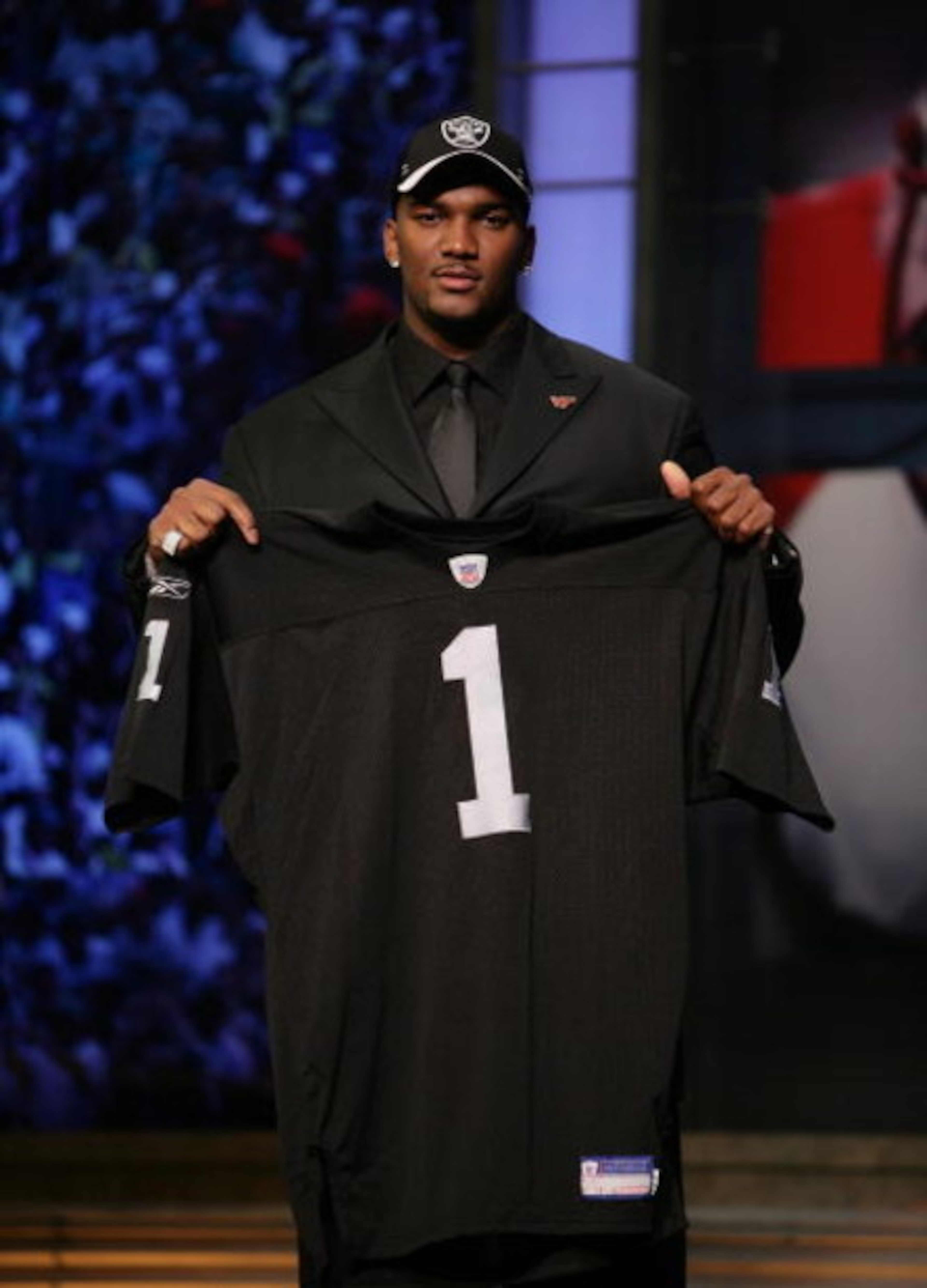 NEW YORK - APRIL 28:  JaMarcus Russell poses with his Oakland Raiders jersey after being chosen first overall by the Oakland Raiders at the 2007 NFL Draft at Radio City Music Hall April 28, 2007 in New York City.  (Photo by Nick Laham/Getty Images)