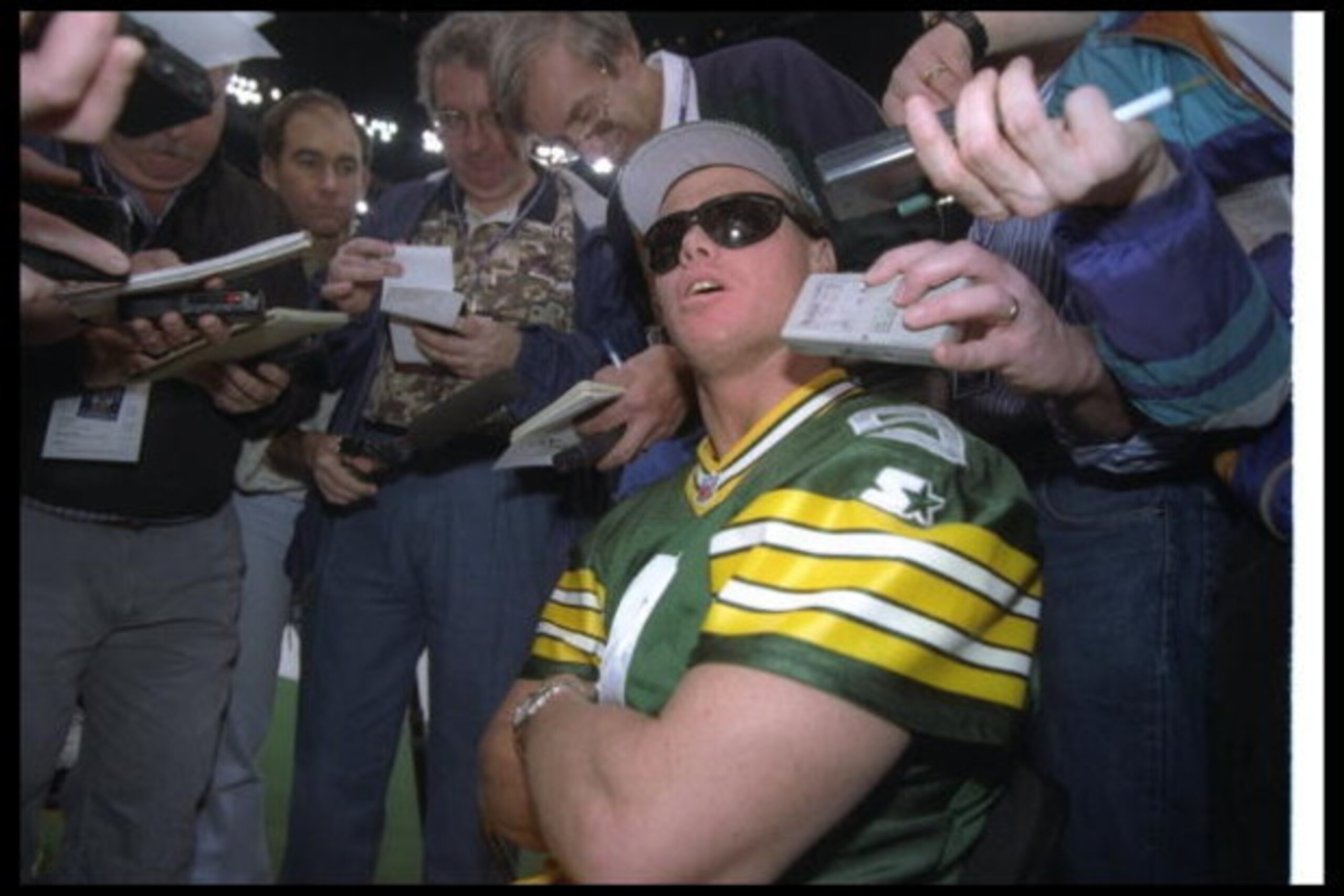 21 Jan 1997: Quarterback Jim McMahon of the Green Bay Packers gets interviewed during Media Day for Super Bowl XXXI against the New England Patriots at the Superdome in New Orleans, Louisiana. The Packers won the game, 35-21.