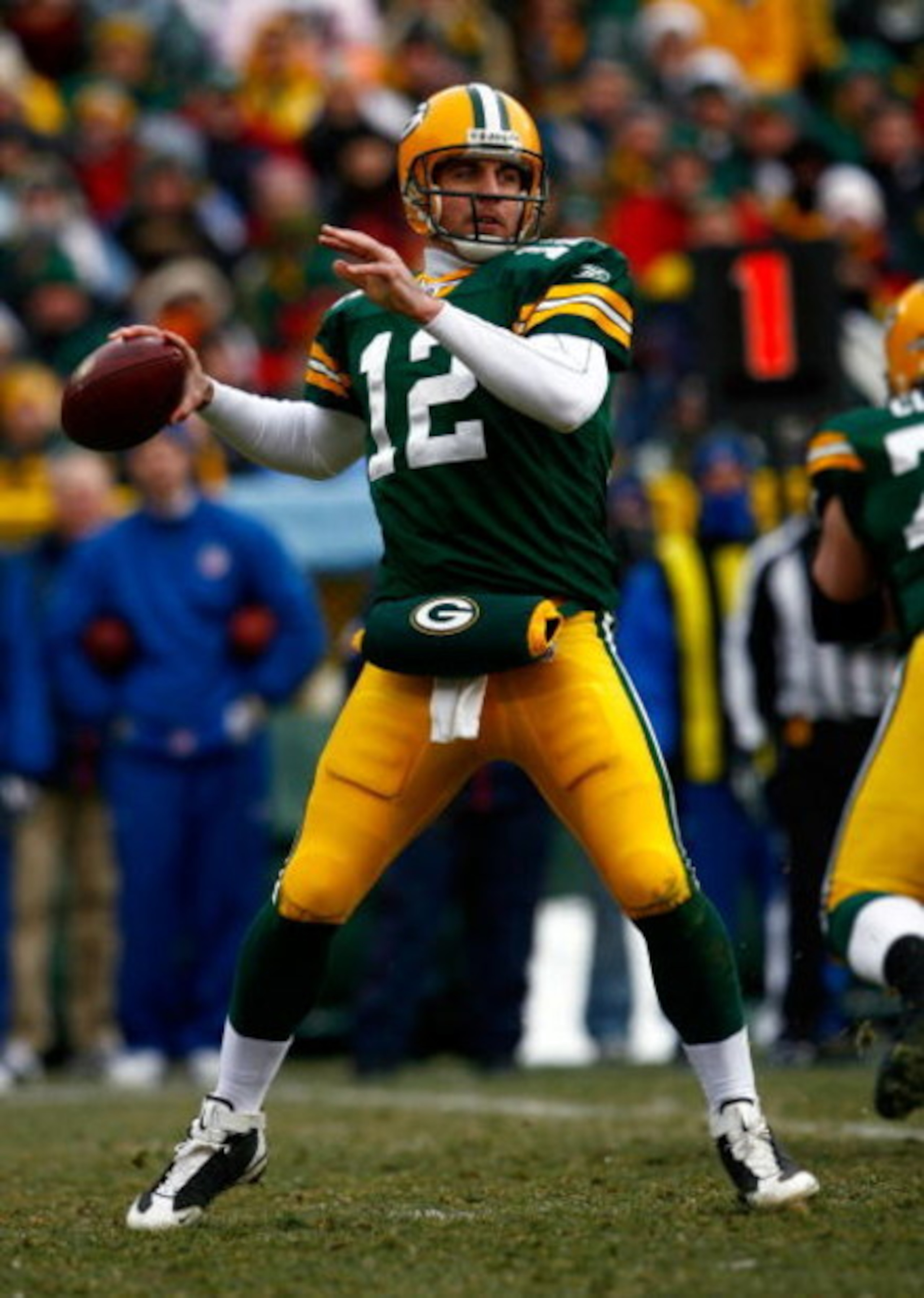 GREEN BAY, WI - DECEMBER 07:  Quarterback Aaron Rodgers #12 of the Green Bay Packers drops back to pass against the Houston Texans during the first quarter at Lambeau Field on December 7, 2008 in Green Bay, Wisconsin. The Texans defeated the Packers 24-21
