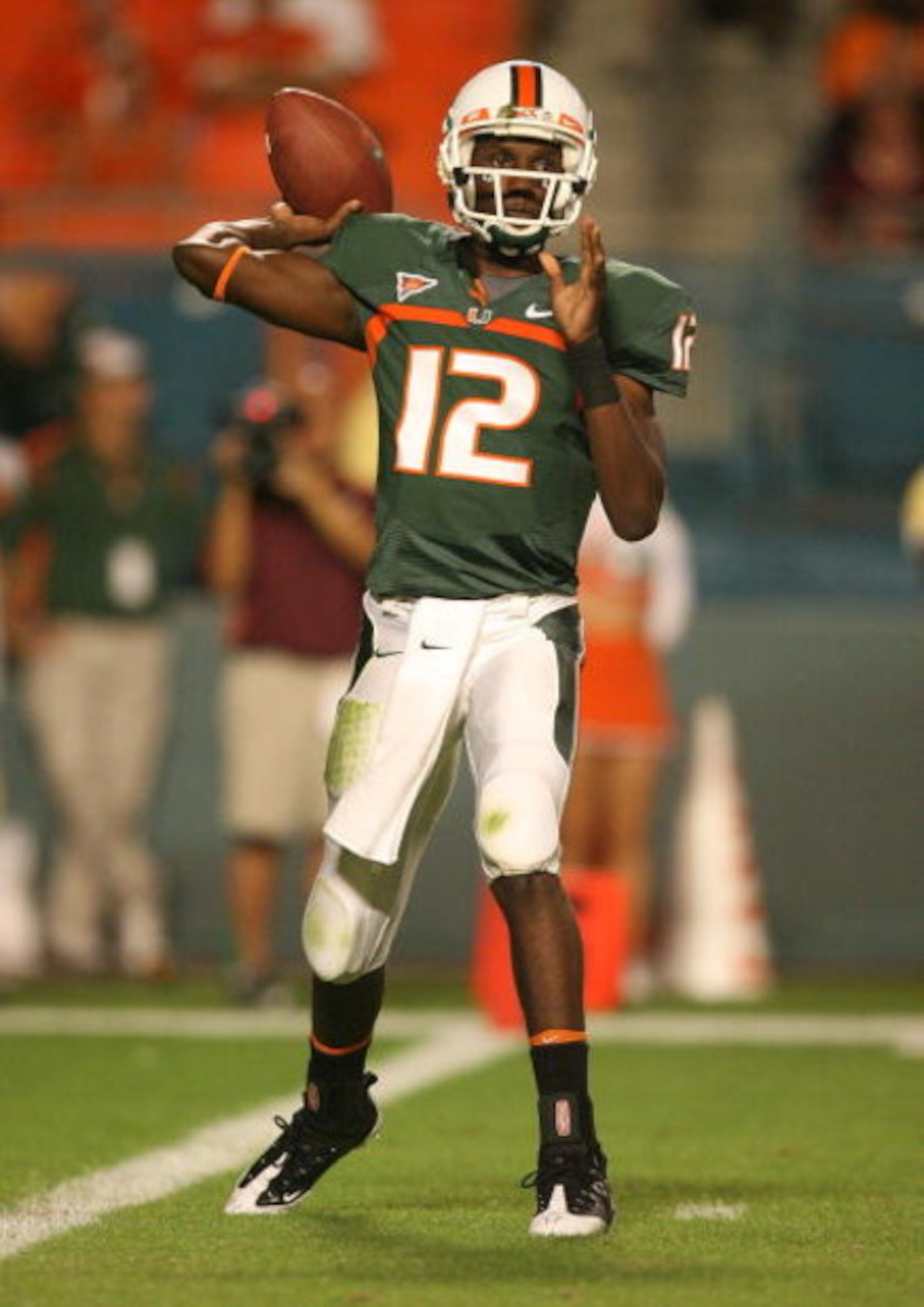 MIAMI - NOVEMBER 13:  Quarterback Jacory Harris #12 of the Miami Hurricanes throws a pass while taking on the Virginia Tech Hokies at Dolphin Stadium on November 13, 2008 in Miami, Florida. Miami defeated Virginia Tech 16-14.  (Photo by Doug Benc/Getty Im