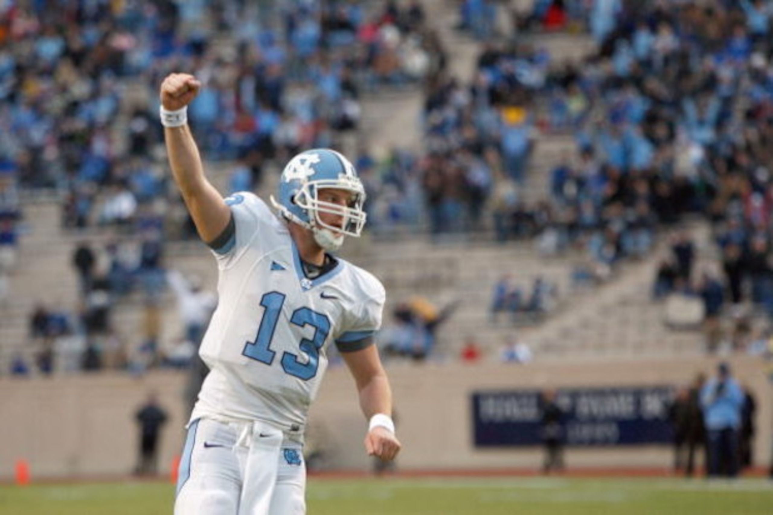 DURHAM, NC - NOVEMBER 29:  Quarterback T.J. Yates #13 of the North Carolina Tar Heels celebrates on the field during the game against the Duke Blue Devils at Wallace Wade Stadium on November 29, 2008 in Durham, North Carolina. (Photo by Kevin C. Cox/Getty