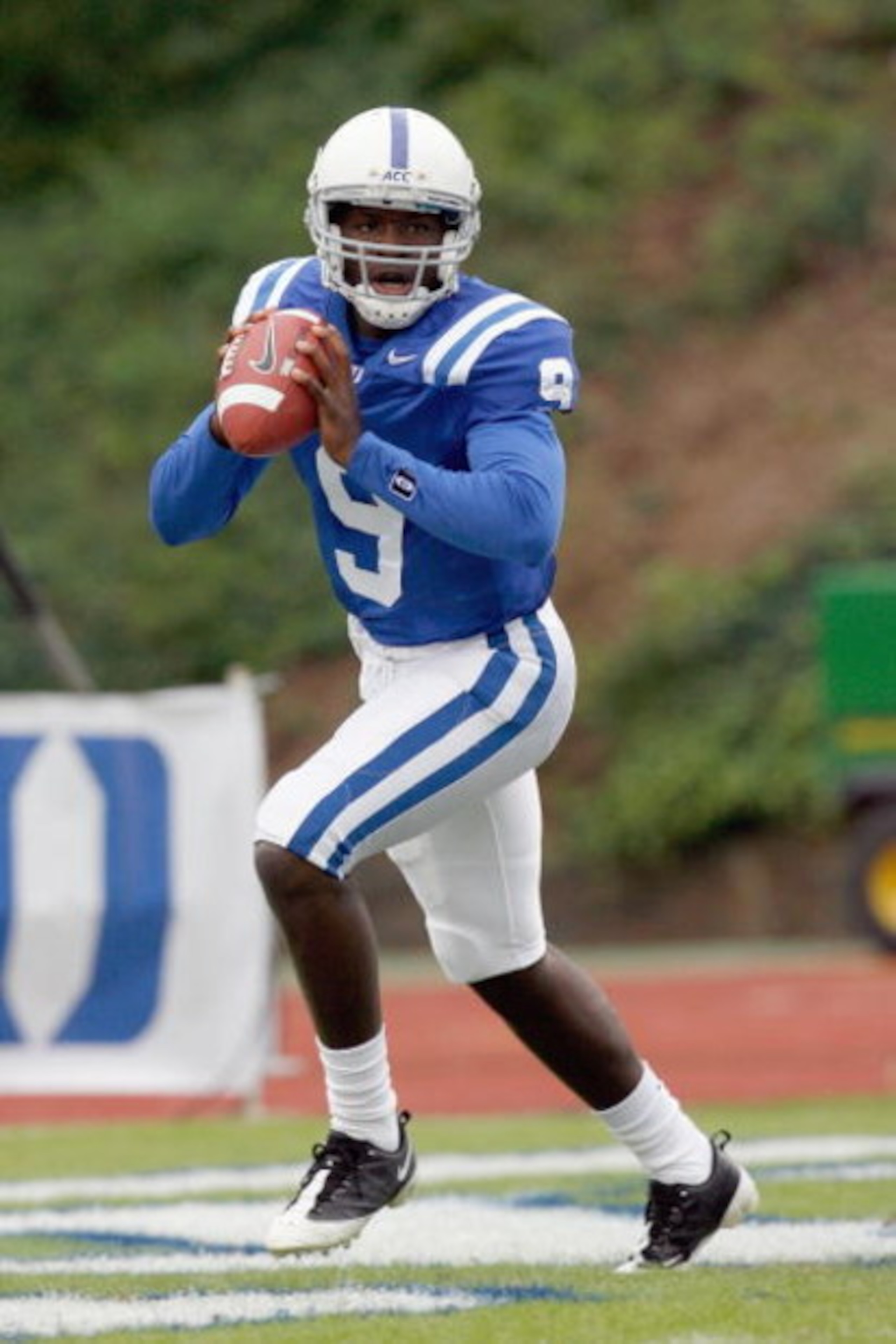 DURHAM, NC - OCTOBER 18:  Quarterback Thaddeus Lewis #9 of the Duke Blue Devils moves to pass the ball during the game against the Miami Hurricanes at Wallace Wade Stadium on October 18, 2008 in Durham, North Carolina.  (Photo by Kevin C. Cox/Getty Images