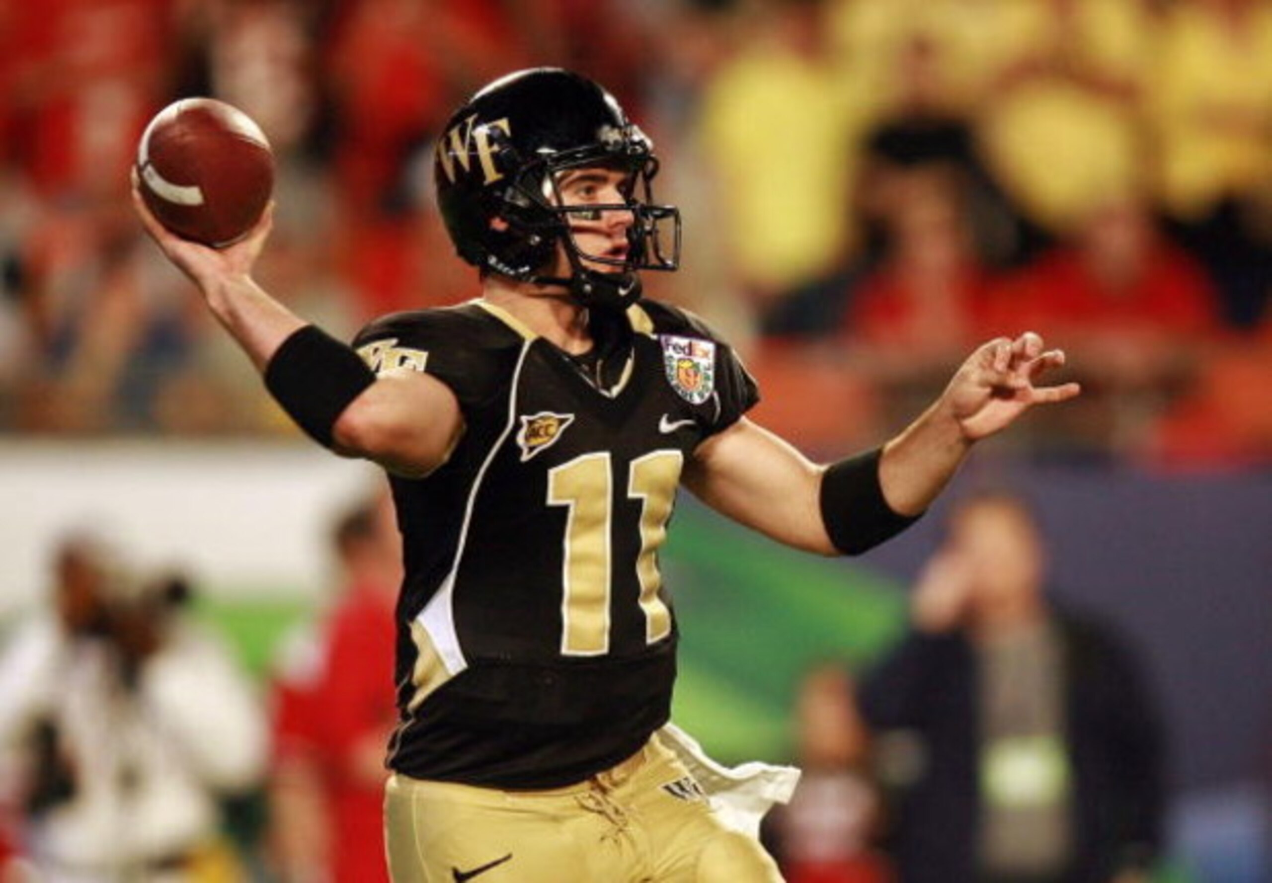 MIAMI GARDENS, FL - JANUARY 02:  Riley Skinner #11 of the Wake Forest Demon Deacons looks to pass against the Louisville Cardinals during the 2007 FedEx Orange Bowl at Dolphin Stadium on January 2, 2007 in Miami Gardens, Florida.  (Photo by Doug Benc/Gett