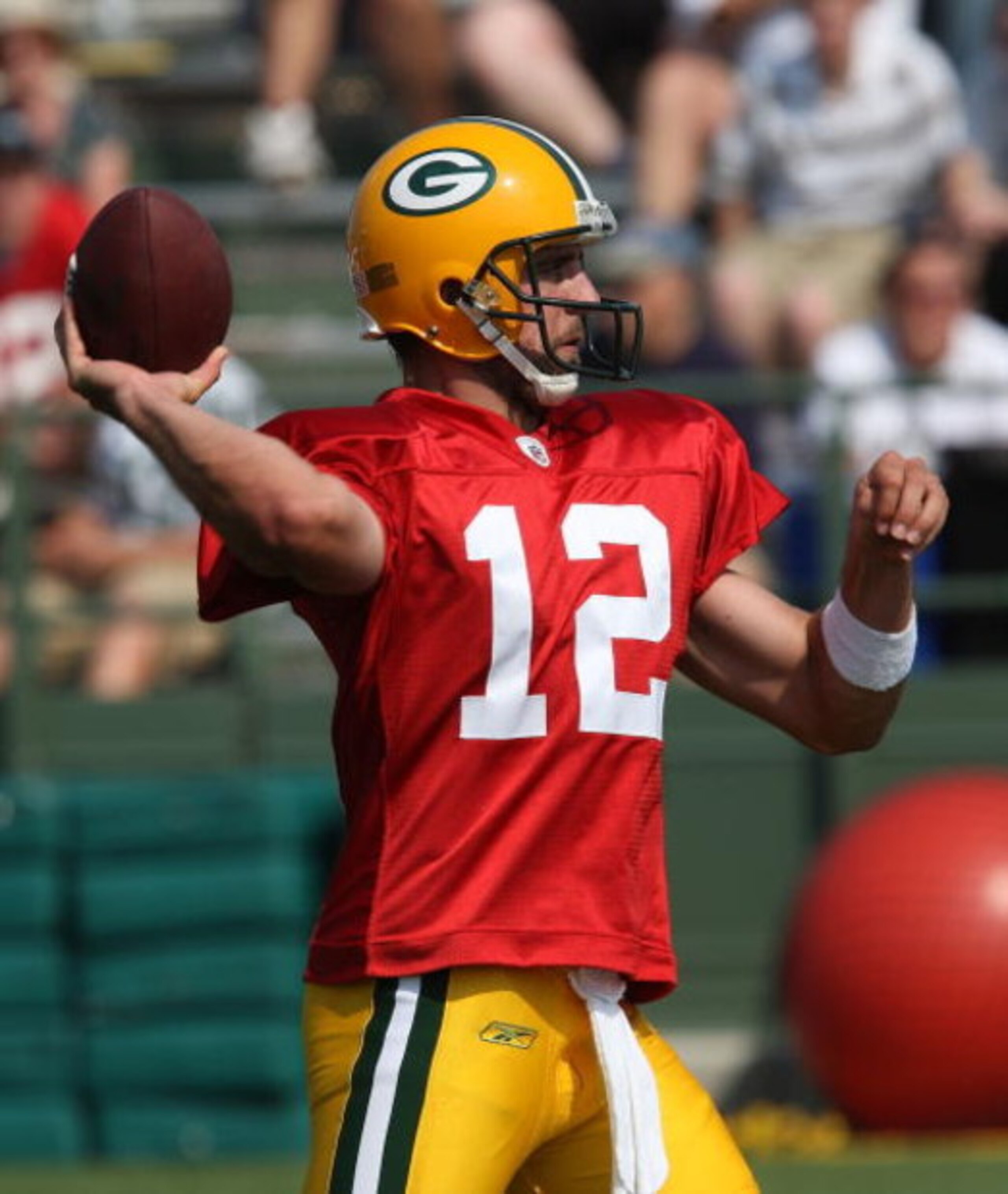 GREEN BAY, WI - AUGUST 03: Aaron Rodgers #12 of the Green Bay Packers passes the ball during practice at summer training camp on August 3, 2009 at the Ray Nitschke Field in Green Bay, Wisconsin. (Photo by Jonathan Daniel/Getty Images)