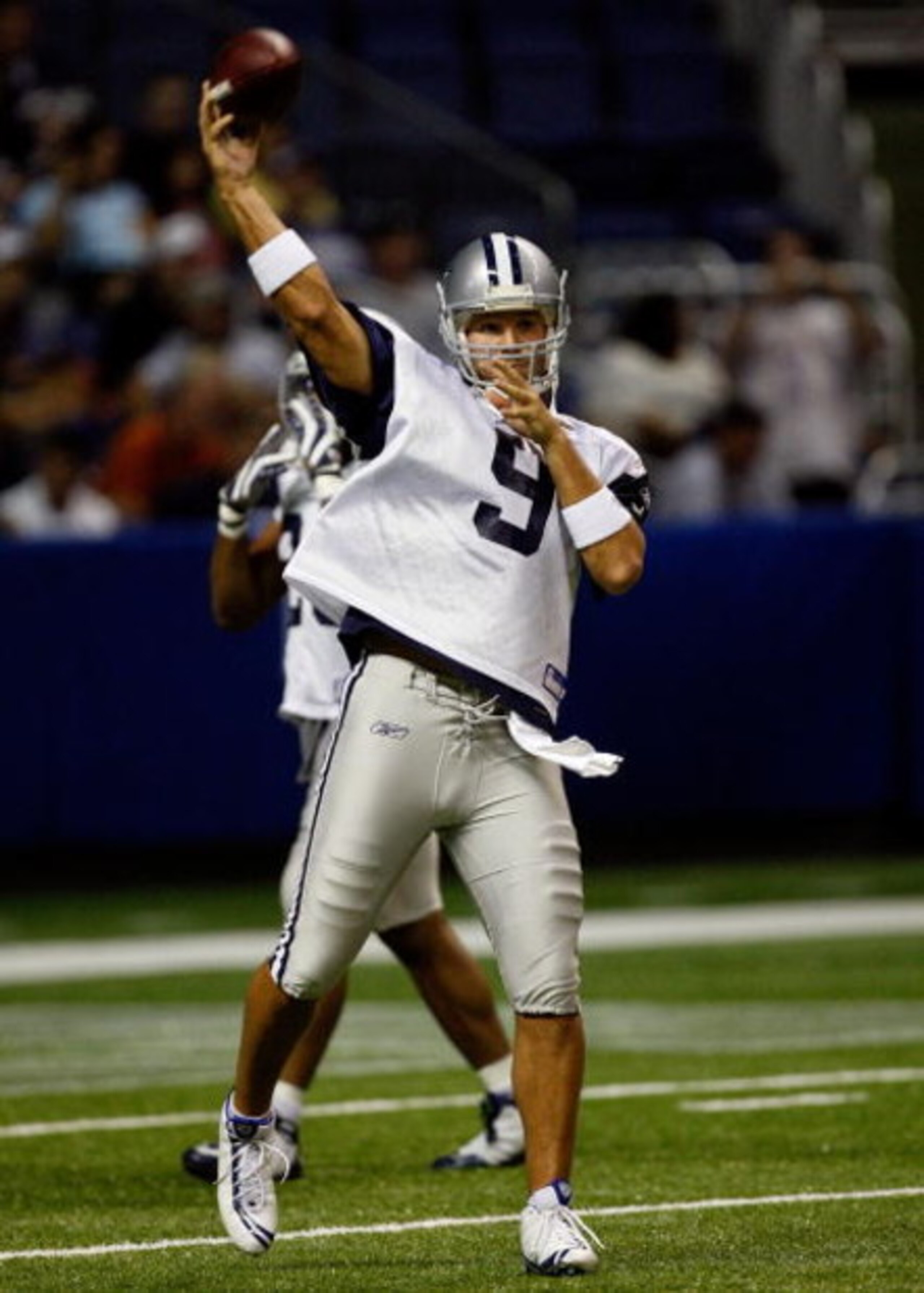 SAN ANTONIO - AUGUST 06:  Quarterback Tony Romo #9 of the Dallas Cowboys during training camp at the Alamodome on August 6, 2009 in San Antonio, Texas.  (Photo by Ronald Martinez/Getty Images)