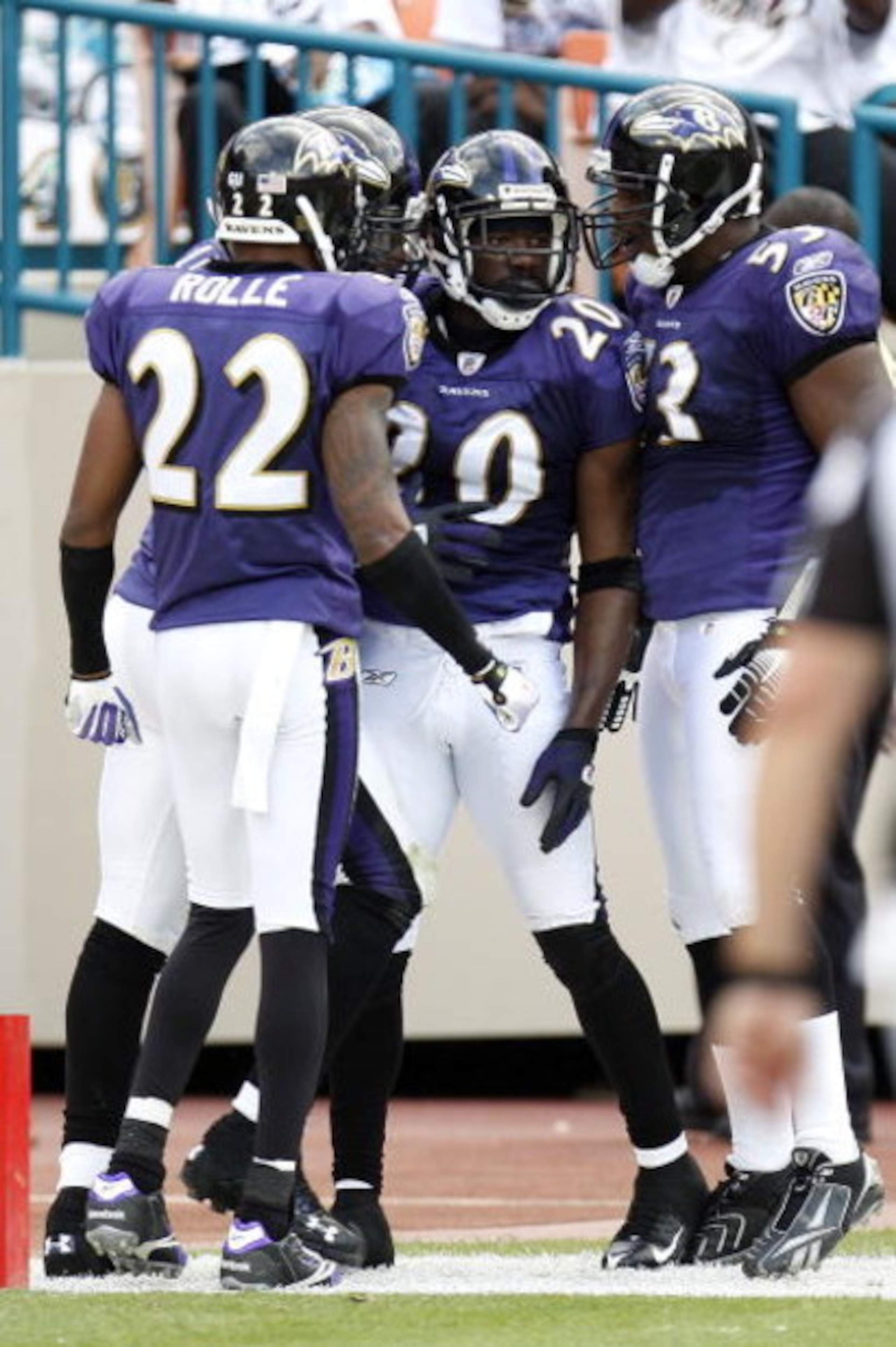 MIAMI - JANUARY 04:  Ed Reed #20 of the Baltimore Ravens is congratulated by Ray Lewis #52 and Samari Rolle #22 after scoring a second quarter interception for a touchdown against the Miami Dolphins during a AFC Wild Card playoff game on January 4, 2009 a