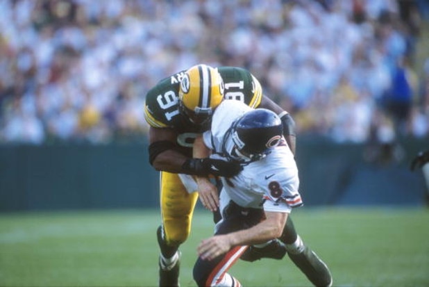 10 Oct 2000:  #91 John Thierry of the Green Bay Packers tackles  #8 Cade McNown of the Chicago Bears during the Bears v Packers game in which the Bears defeated the Packers 27-24 at Lambeau Field in Green Bay, Wisconsin. Mandatory Credit: Jonathan Daniel/