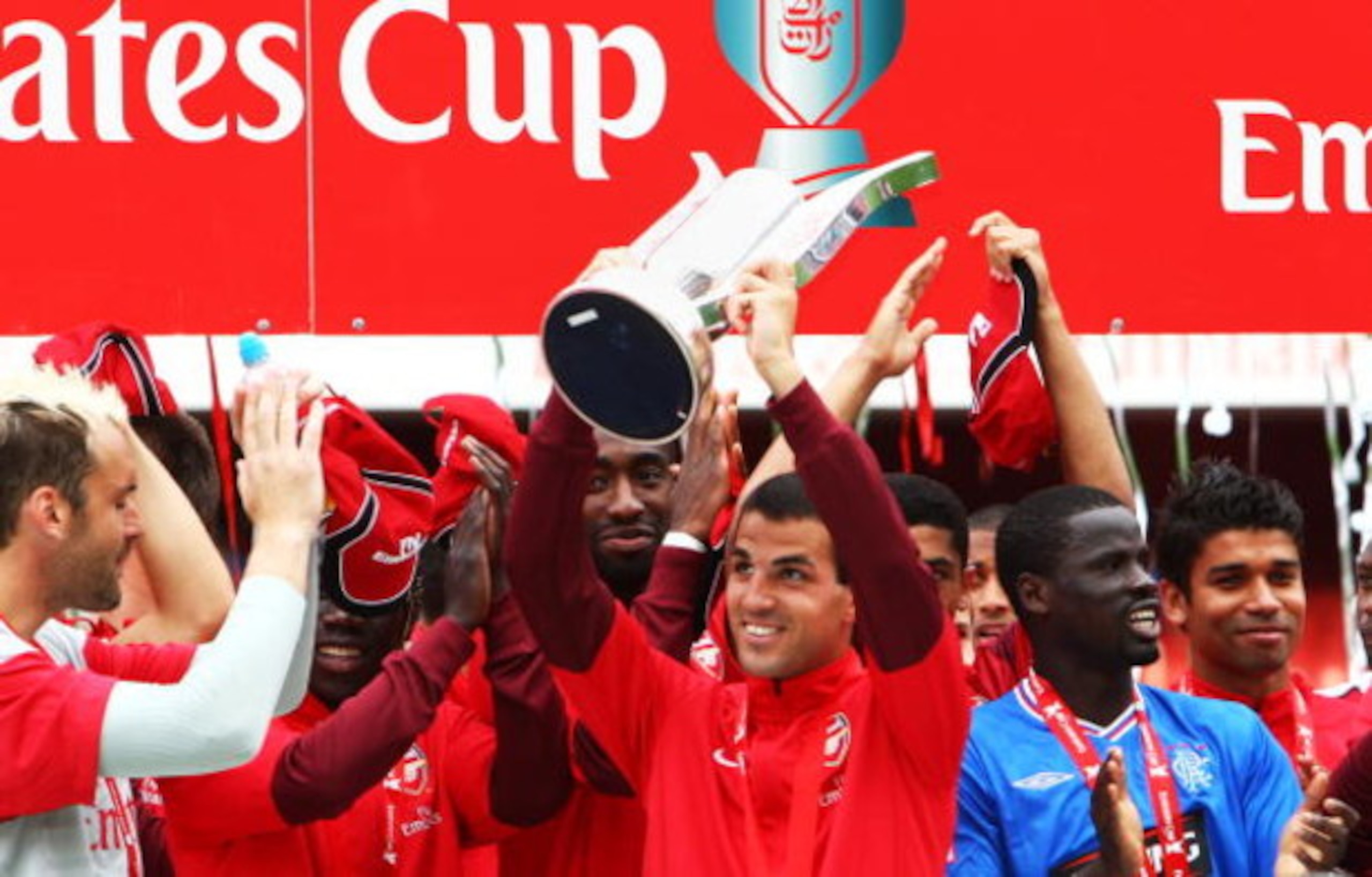 LONDON, ENGLAND - AUGUST 02:  Arsenal  captain Cesc Fabregas lifts the Trophy following his team's victory during the Emirates Cup match between Arsenal and Glasgow Rangers at the Emirates Stadium on August 2, 2009 in London, England.  (Photo by Phil Cole