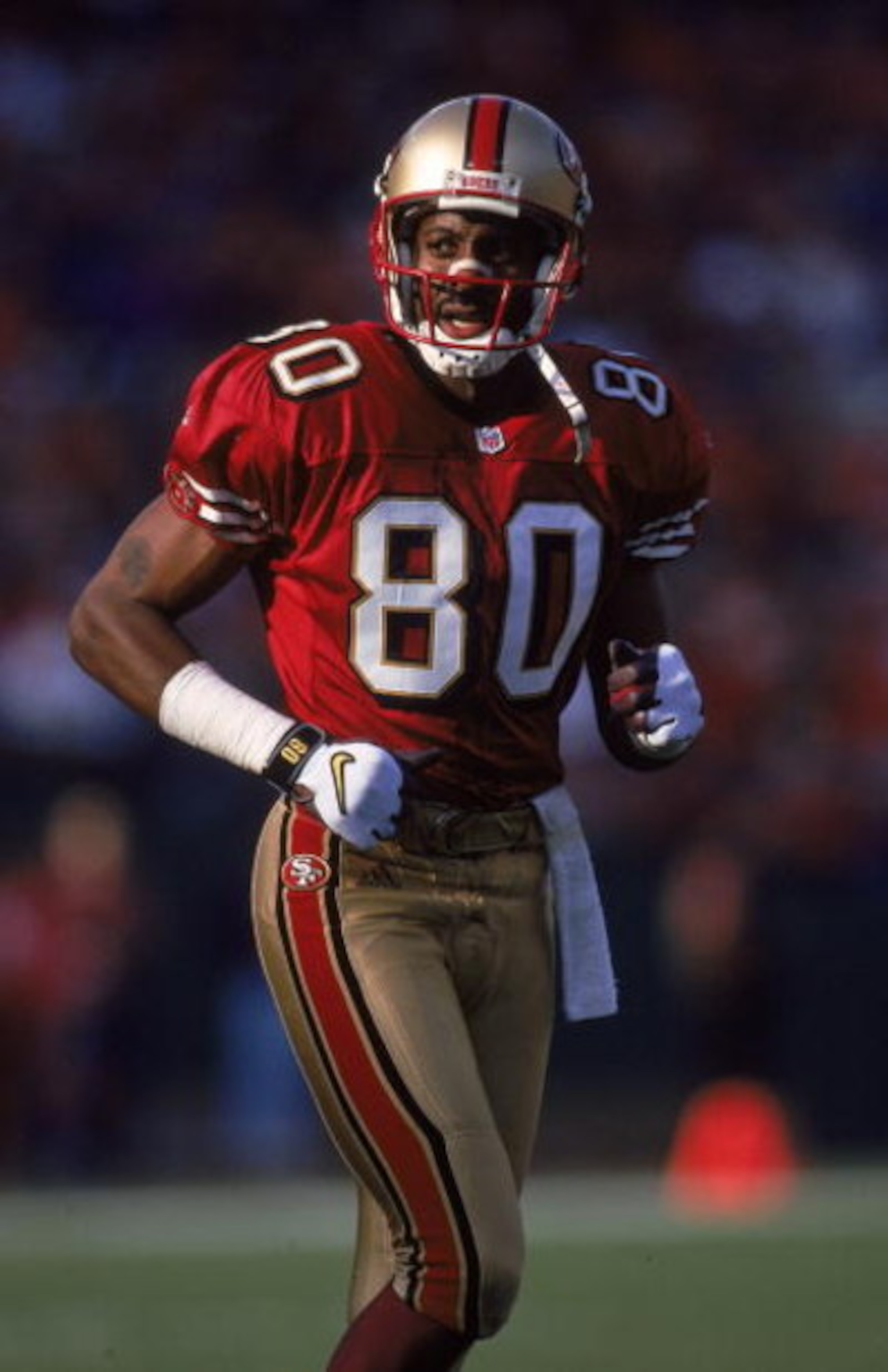 12 Dec 1999:  Jerry Rice #80 of the San Francisco 49ers looks on from the field during the game against the Atlanta Falcons at 3 Comm Park in San Francisco, California. The 49ers defeated the Falcons 26-7. Mandatory Credit: Tom Hauck  /Allsport