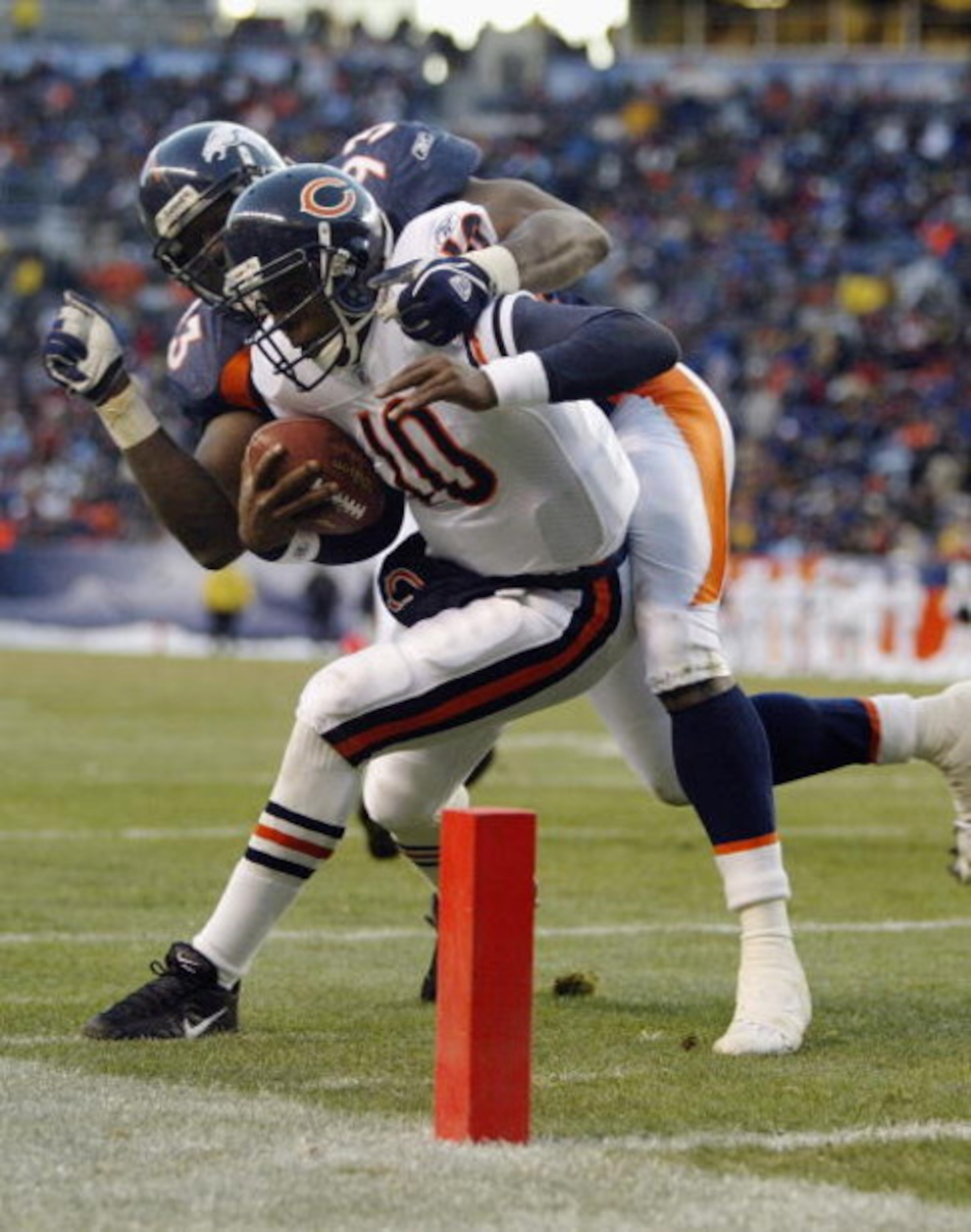 DENVER - NOVEMBER 23: Quarterback Kordell Stewart #10 of the Chicago Bears gets run out of bounds by Trevor Pryce #93 of the Denver Broncos on November 23, 2003 at Invesco Field at Mile High in Denver, Colorado. The Bears defeated the Broncos 19-10. (Ph DENVER - NOVEMBER 23: Quarterback Kordell Stewart #10 of the Chicago Bears gets run out of bounds by Trevor Pryce #93 of the Denver Broncos on November 23, 2003 at Invesco Field at Mile High in Denver, Colorado. The Bears defeated the Broncos 19-10. (Ph