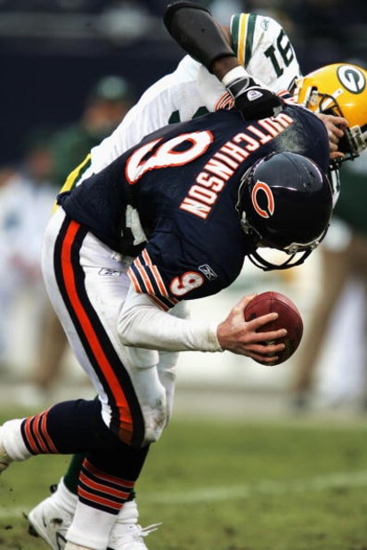 CHICAGO - JANUARY 2: Quarterback Chad Hutchinson #9 of the Chicago Bears is sacked by defensive end R-Kal Truluck #91 of the Green Bay Packers on January 2, 2005 at Soldier Field in Chicago, Illinois. The Packers defeated the Bears 31-14. (Photo by Jonath