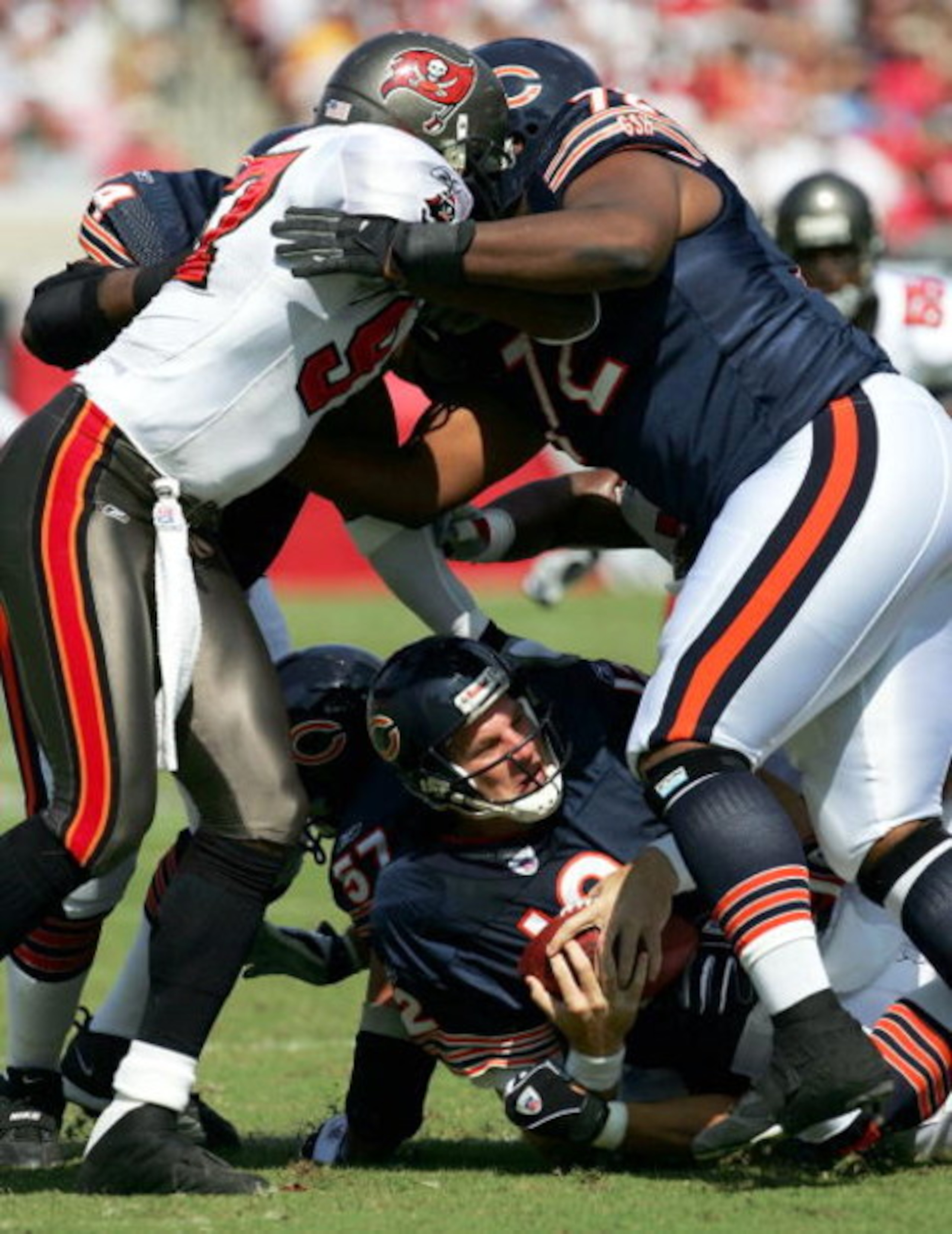 TAMPA, FL - OCTOBER 24: Quarterback Jonathan Quinn #12 of the Chicago Bears is sacked by Greg Spires #94 of the Tampa Bay Buccaneers during the first half of the game at Raymond James Stadium on October 24, 2004 in Tampa, Florida. (Photo by Jamie Squire/ TAMPA, FL - OCTOBER 24: Quarterback Jonathan Quinn #12 of the Chicago Bears is sacked by Greg Spires #94 of the Tampa Bay Buccaneers during the first half of the game at Raymond James Stadium on October 24, 2004 in Tampa, Florida. (Photo by Jamie Squire/