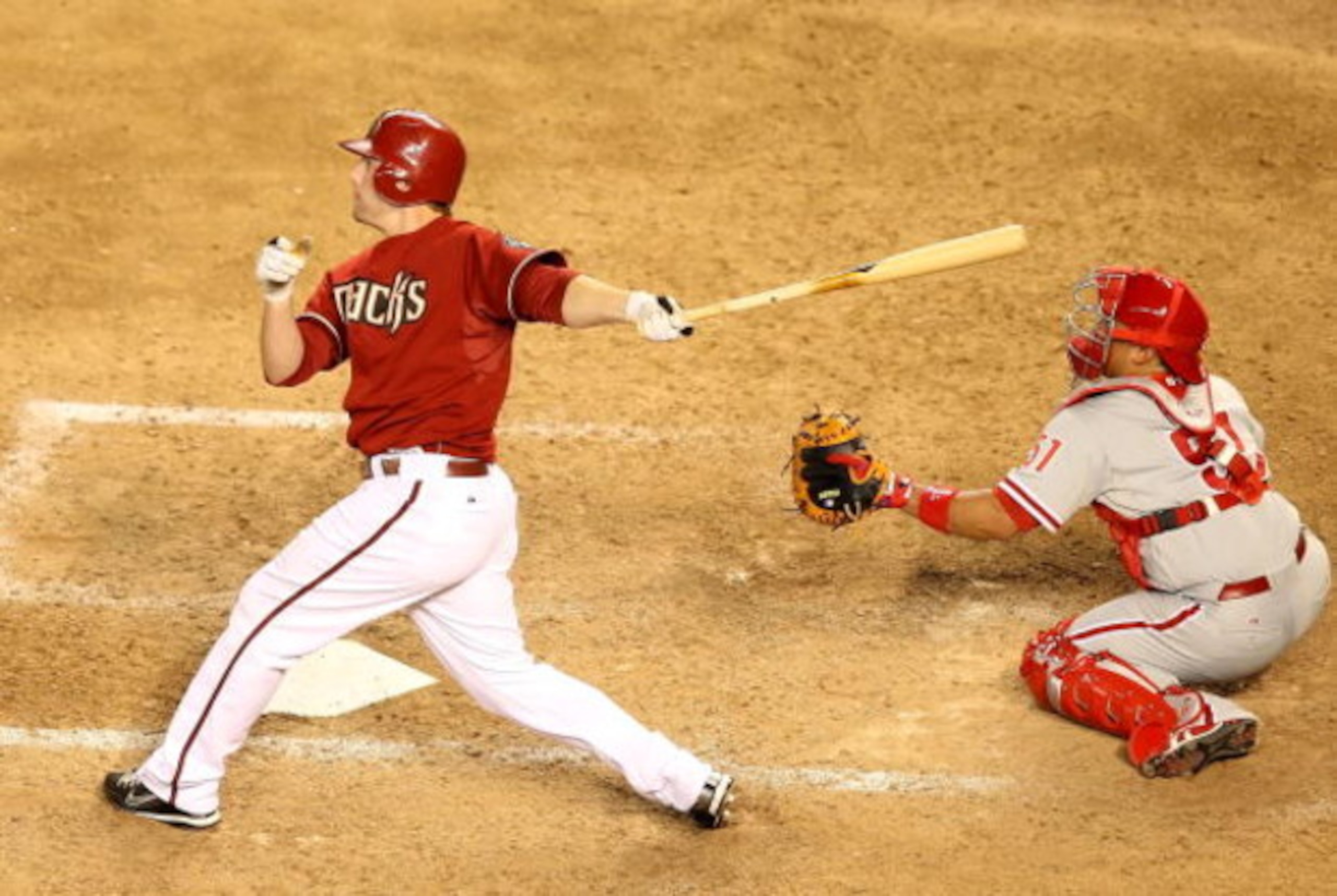 PHOENIX - JULY 28:  Mark Reynolds #27 of the Arizona Diamondbacks hits a 2 run home run against the Philadelphia Phillies during the ninth inning of the major league baseball game at Chase Field on July 28, 2009 in Phoenix, Arizona. The Phillies defeated 