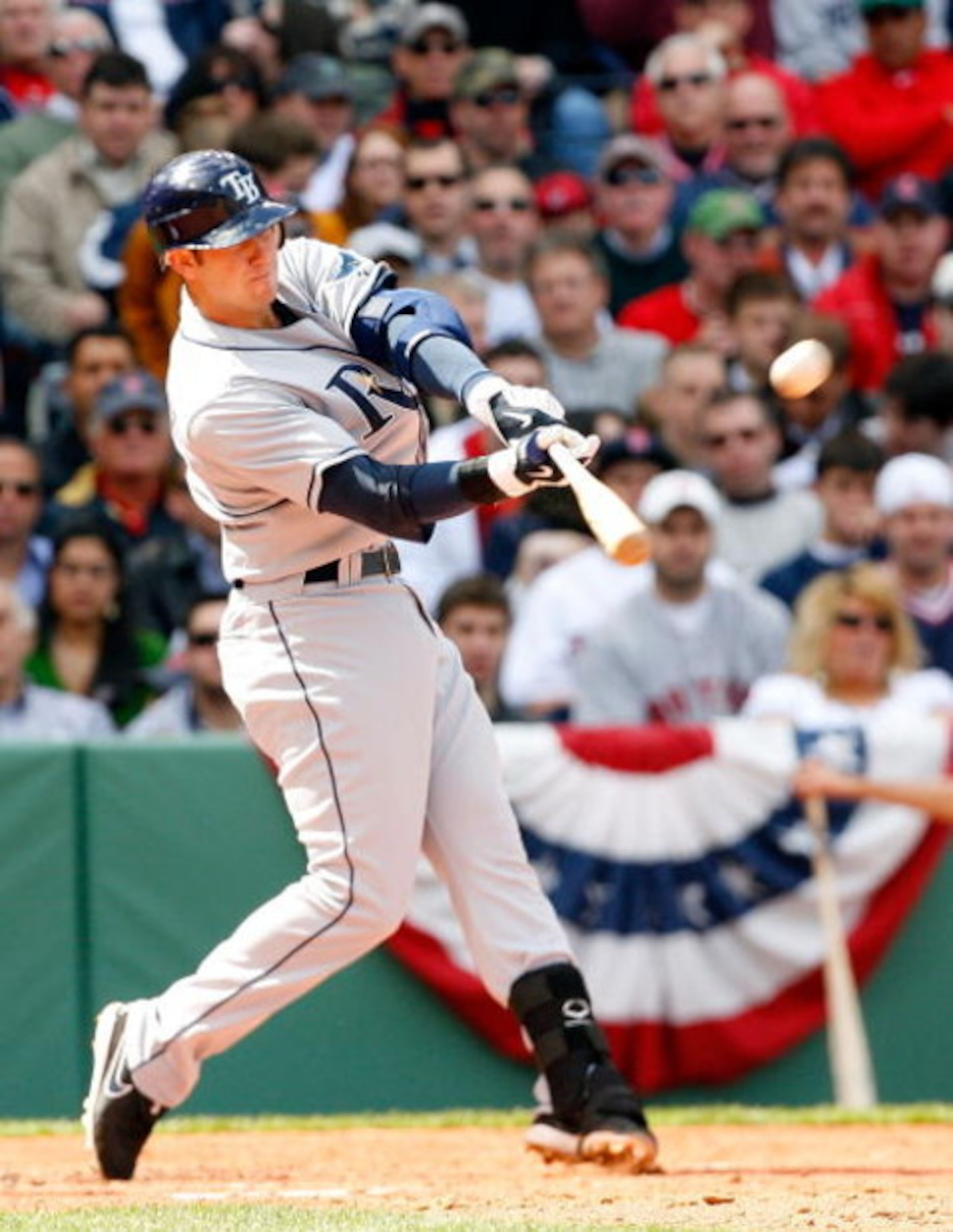 BOSTON - APRIL 9: Evan Longoria #3 of the Tampa Bay Rays hits a home run against the Boston Red Sox at Fenway Park April 9, 2009, in Boston, Massachusetts. (Photo by Jim Rogash/Getty Images)