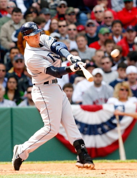 BOSTON - APRIL 9: Evan Longoria #3 of the Tampa Bay Rays hits a home run against the Boston Red Sox at Fenway Park April 9, 2009, in Boston, Massachusetts. (Photo by Jim Rogash/Getty Images)