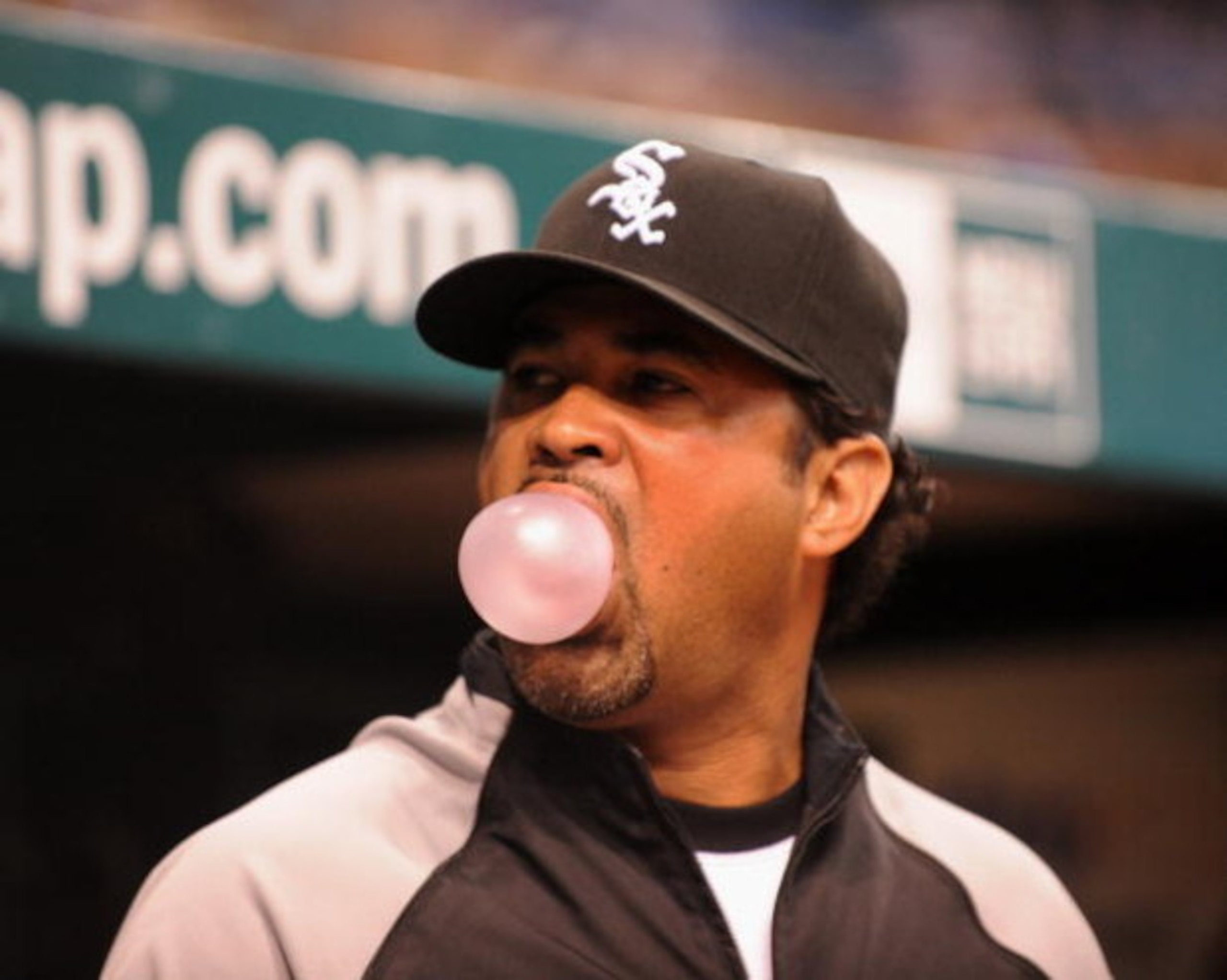 ST. PETERSBURG, FL - APRIL 16: Manager Ozzie Guillen #13 of the  Chicago White Sox blows a bubble against the Tampa Bay Rays on April 16, 2009 at Tropicana Field in St. Petersburg, Florida.  (Photo by Al Messerschmidt/Getty Images)