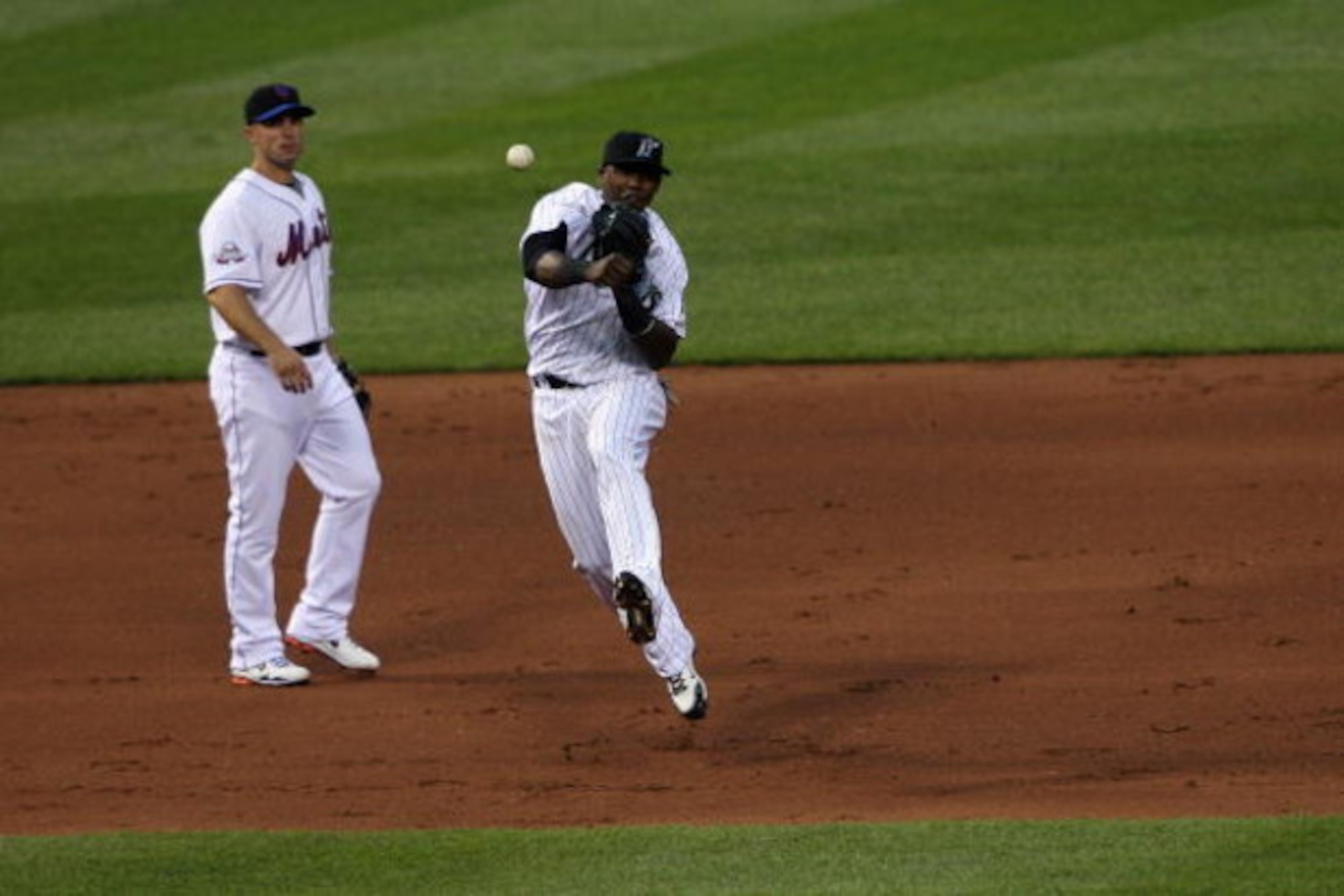 ST. LOUIS, MO - JULY 14:  National League All-Star Hanley Ramirez of the Florida Marlins throws as David Wright of the New York Mets looks on during the 2009 MLB All-Star Game at Busch Stadium on July 14, 2009 in St Louis, Missouri. (Photo by Elsa/Getty I