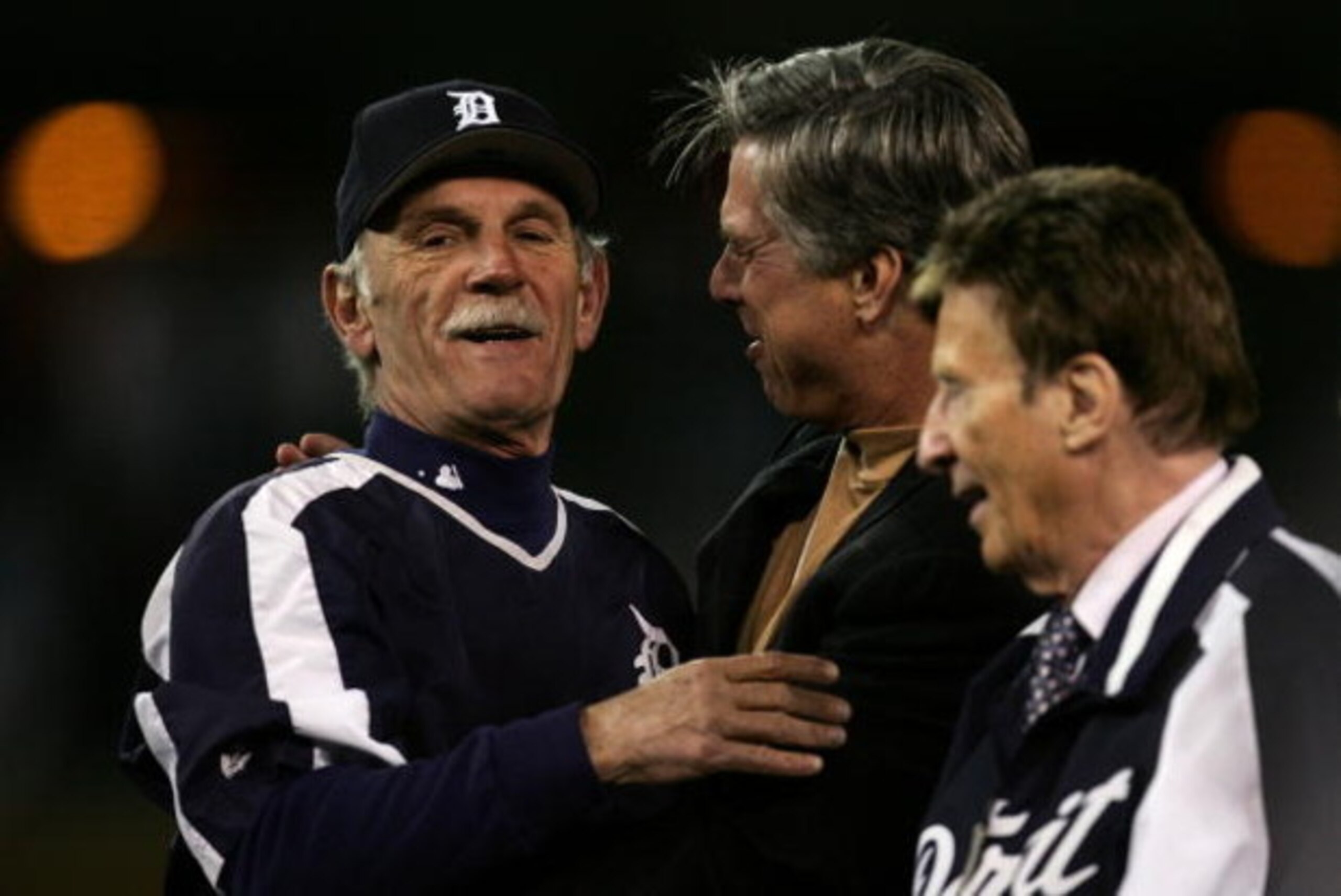 DETROIT - OCTOBER 14:  Manager Jim Leyland (L) and General Manager Dave Dombrowski (C) of the Detroit Tigers celebrate after the Tigers won 6-3 against the Oakland Athletics during Game Four of the American League Championship Series October 14, 2006 at C