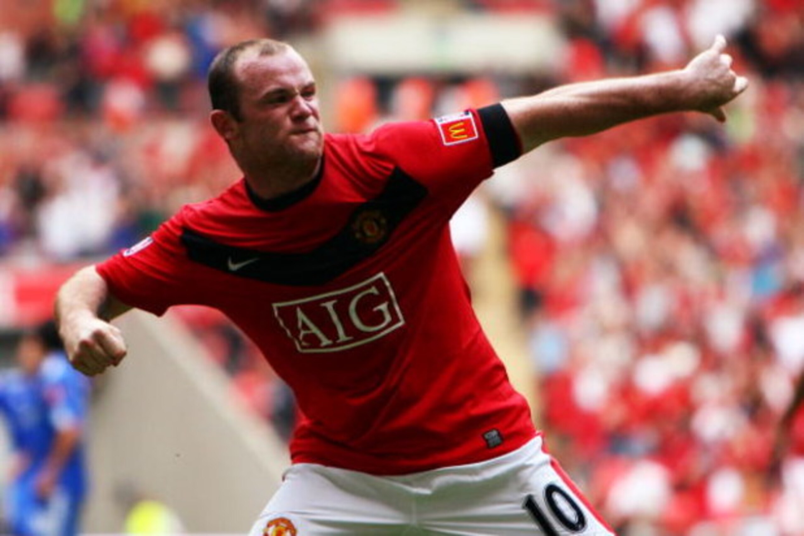 LONDON, ENGLAND - AUGUST 09:  Wayne Rooney of Manchester United celebrates as he scores their second goal during the FA Community Shield match between Manchester United and Chelsea at Wembley Stadium on August 9, 2009 in London, England.  (Photo by Jamie 