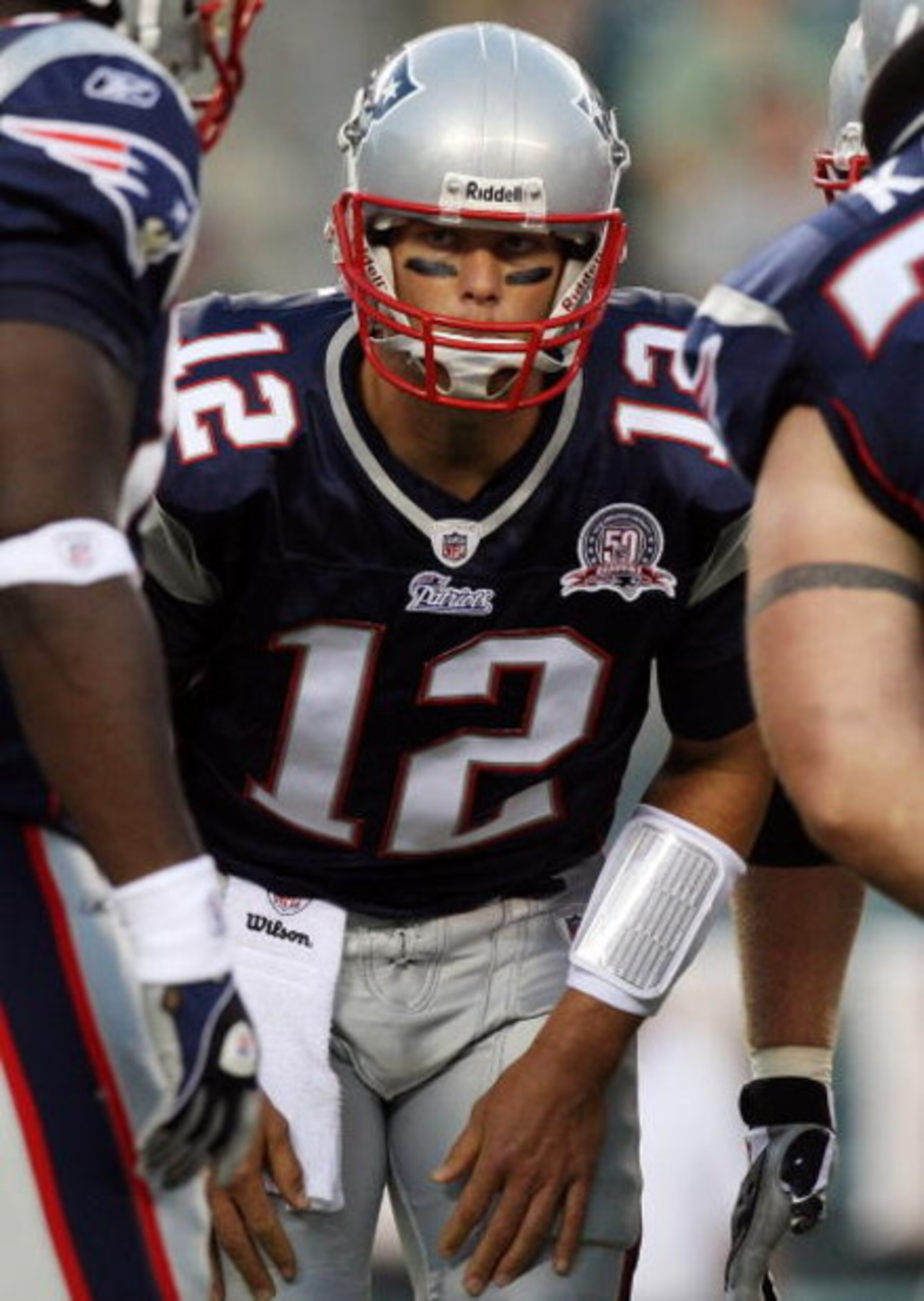 PHILADELPHIA - AUGUST 13:  Tom Brady #12 of the New England Patriots huddles with his teammates against the Philadelphia Eagles on August 13, 2009 at Lincoln Financial Field in Philadelphia, Pennsylvania.  (Photo by Jim McIsaac/Getty Images)